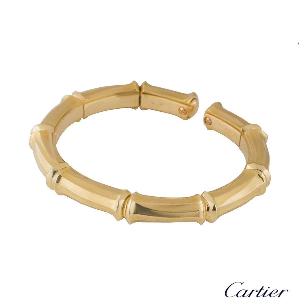 A vintage 18k yellow gold Cartier from the Bamboo collection. The open work bangle comprises of 9 bamboo flexi links. The bangle would fit a wrist of up to 16.5cm and has a gross weight of 54.40 grams.

The bangle comes complete with a RichDiamonds