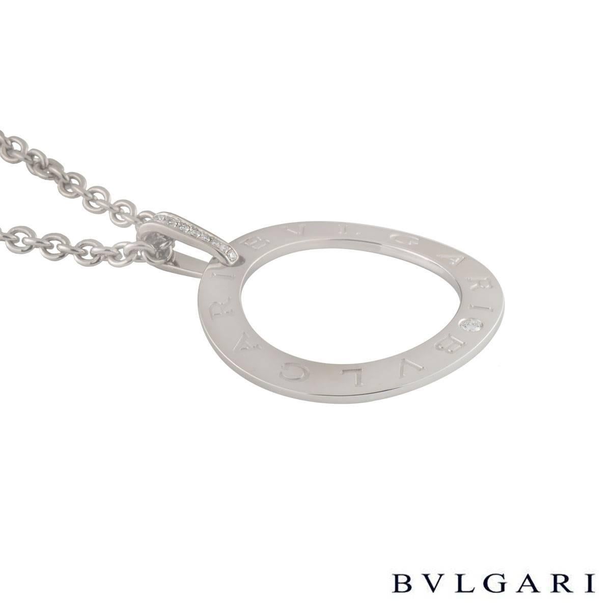 A lovely 18k white gold Bvlgari necklace from the Bvlgari Bvlgari collection. The necklace comprises of a circular openwork motif with 'Bvlgari Bvlgari' embossed around the outer edge. The necklace loop bail has 9 round brilliant cut diamonds in a