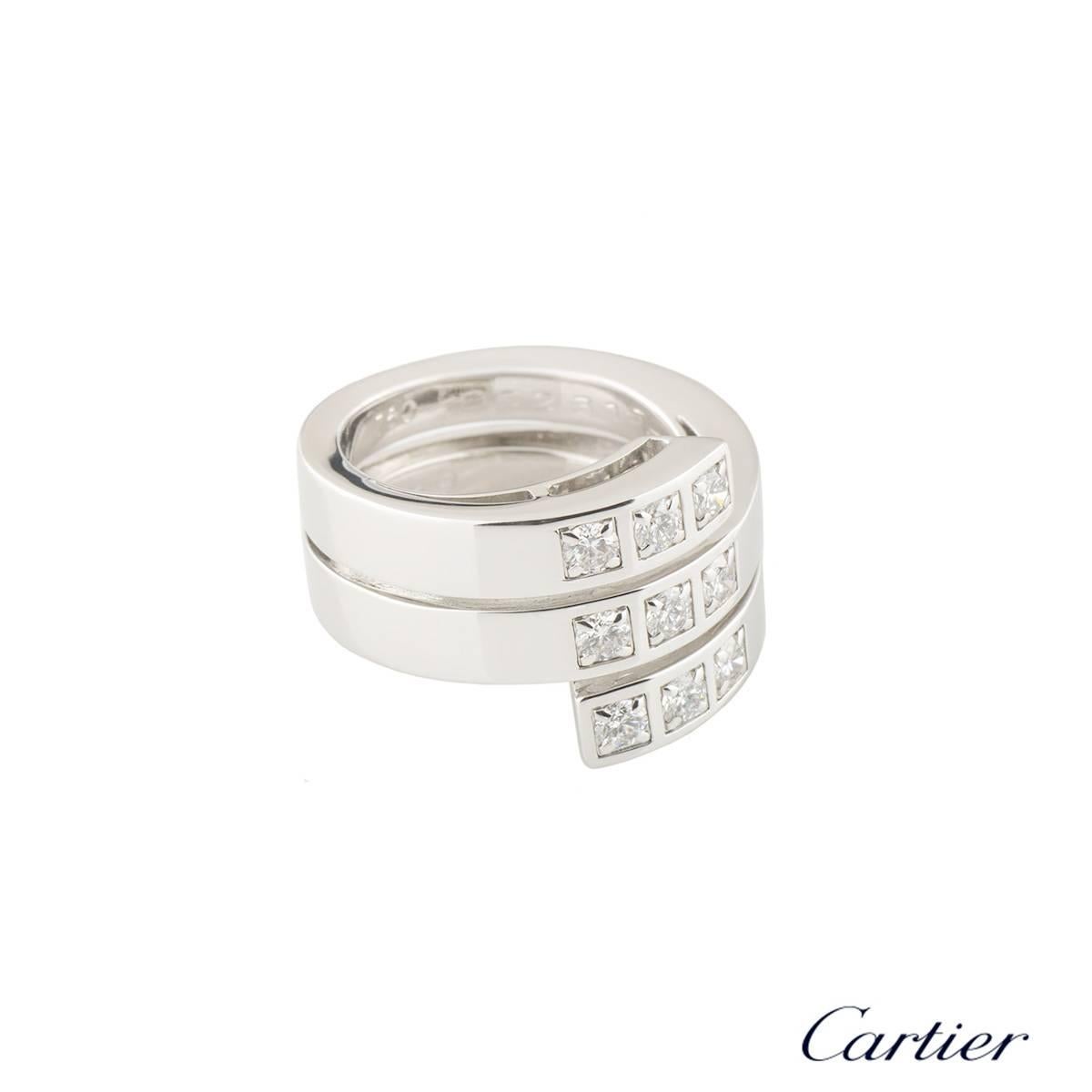 A stylish 18k white gold Cartier diamond dress ring. The ring comprises of a triple spiral band with 3 rows of round brilliant cut diamonds set vertically in the centre. The diamonds have a total weight of approximately 0.63ct F colour and VVS