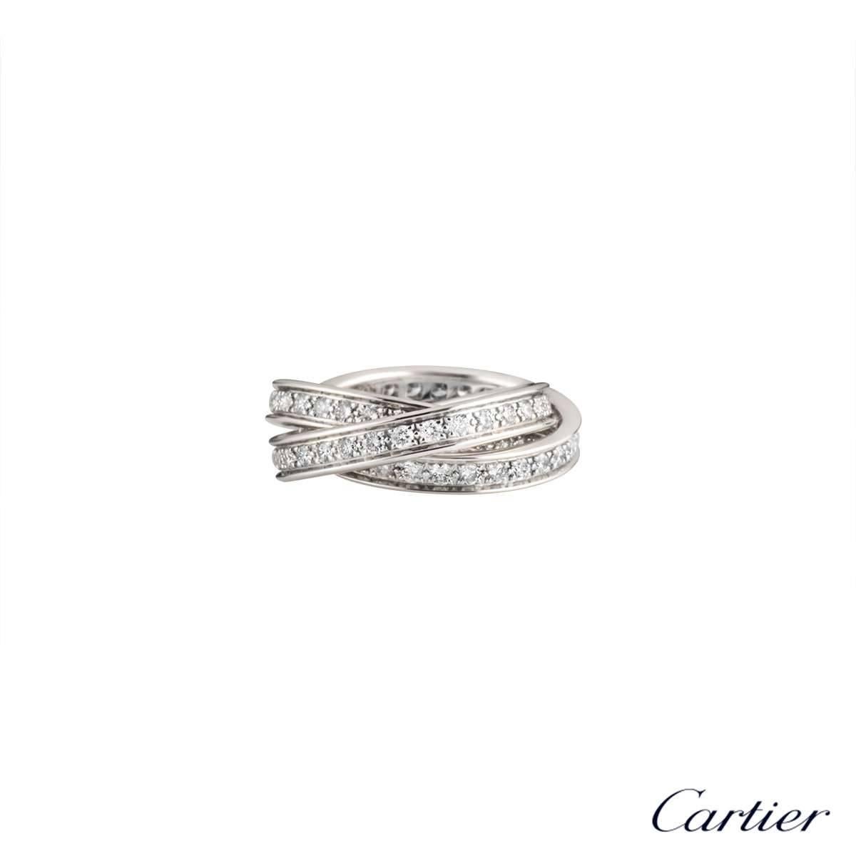 An 18k white gold diamond set ring from the Trinity de Cartier collection by Cartier. The ring is composed of three entwined round brilliant cut diamond set bands, totalling 1.55ct, G+ colour and VS+ clarity. The ring is a US 4 1/2, EU size 48 and