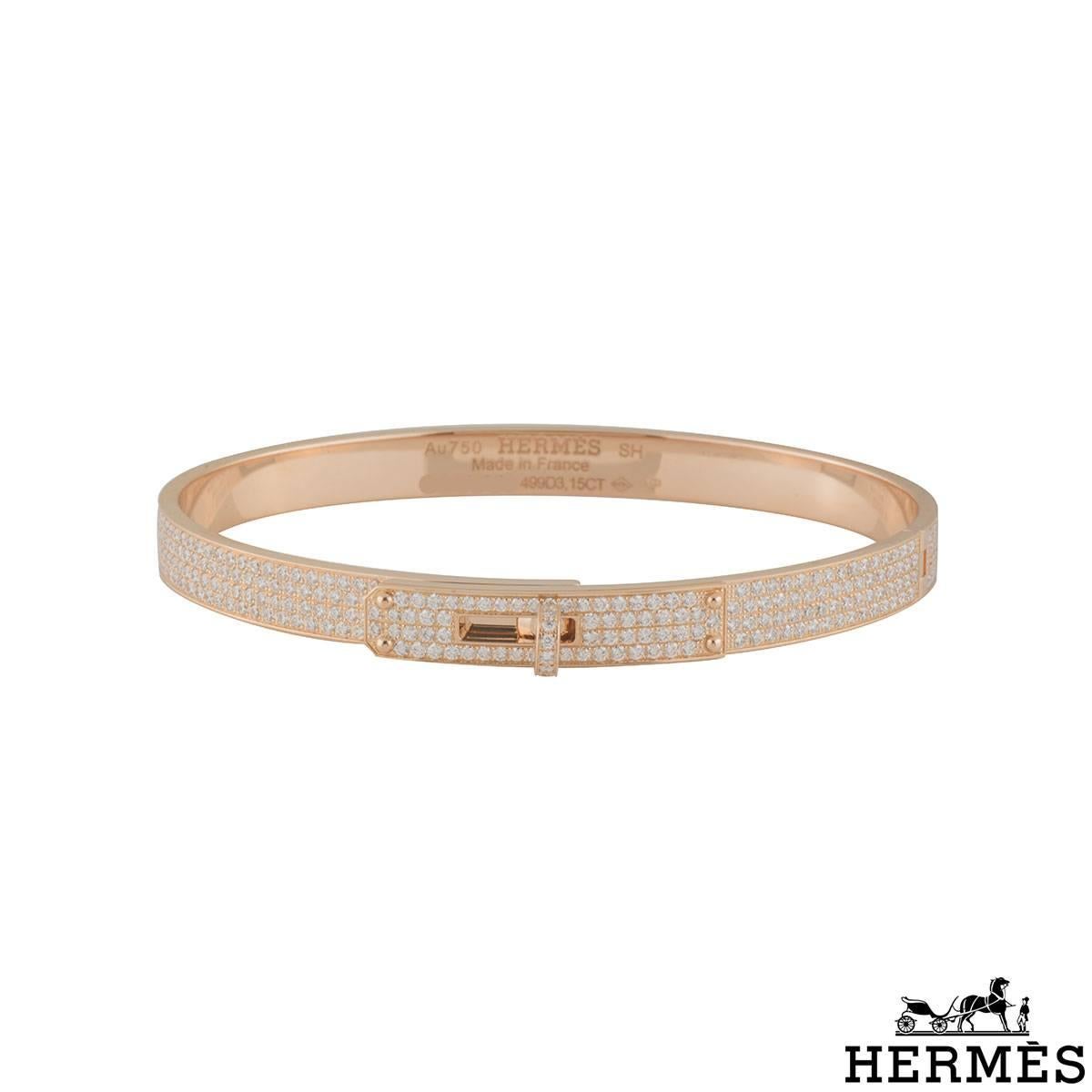 A sparkly 18k rose gold diamond Hermes bangle from the Kelly collection. The 5mm wide bangle comprises of pave set diamonds around the outer edge. There are 499 round brilliant cut diamonds with total weight of 3.15ct, D-F colour and VVS1 clarity.