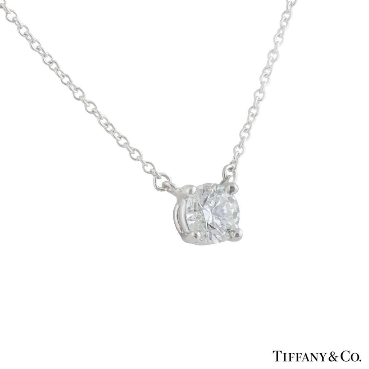 A beautiful platinum diamond Tiffany & Co. pendant. The pendant comprises of a solitaire diamond in a 4 claw with a weight of 0.61ct, J colour and VS1 clarity. The diamond scores an excellent rating in all three aspects for cut, polish and symmetry