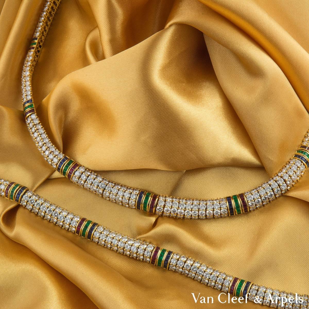 A beautiful 18k yellow gold multi-gemstone Van Cleef & Arpels jewellery suite. The jewellery suite features a line necklace and line bracelet. The necklace comprises of 4 rows of round brilliant cut diamonds, complemented with 10 block rows of