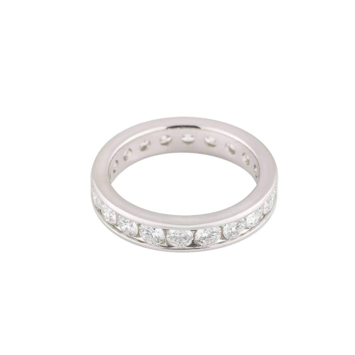 A beautiful diamond full eternity ring in platinum. The ring is channel set with 20 round brilliant cut diamonds totalling approximately 2.00ct, predominantly G-H colour and VS in clarity. The ring measures 4mm in width and is a US size 5 3/4, EU