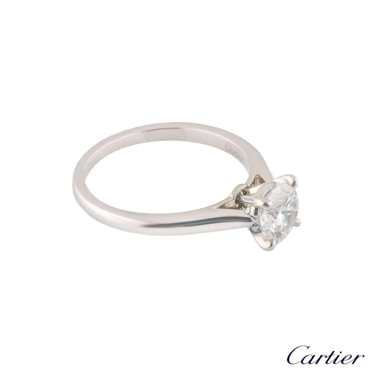 A beautiful platinum Cartier diamond engagement ring from the 1895 Solitaire collection. The ring comprises of a round brilliant cut diamond in a 4 claw setting with a total weight of 0.85ct, E colour and VS1 clarity. The ring measures a US size 5,