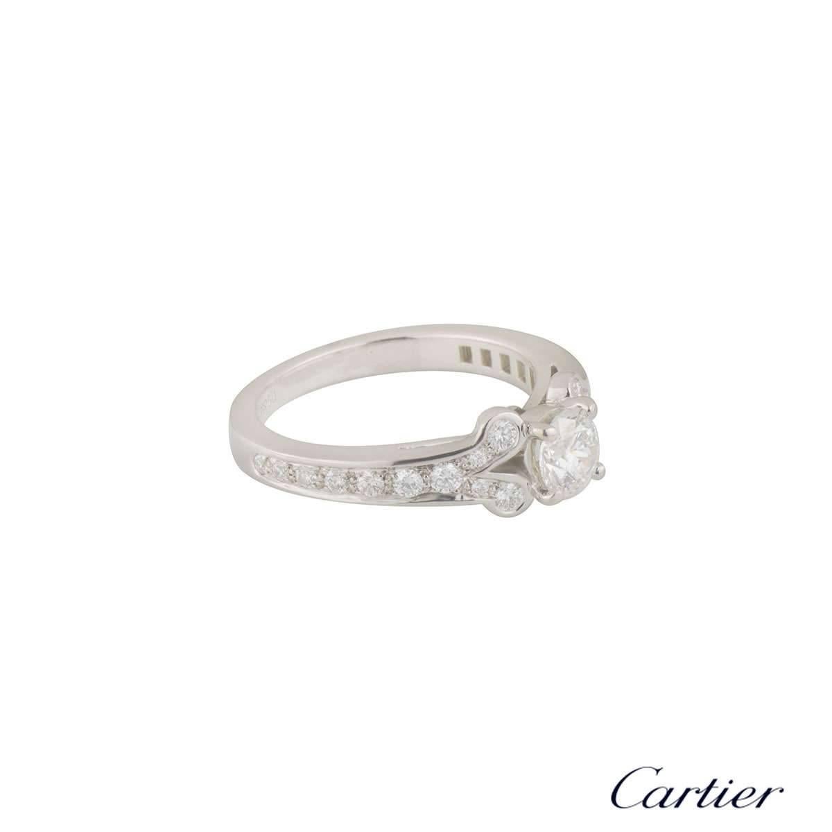 A beautiful platinum Cartier diamond ring from the Ballerine collection. The ring comprises of a round brilliant cut diamond in a 4 claw setting with a weight of 0.53ct, G colour and VS1 clarity. The ring has diamond set rounded shoulders, set with