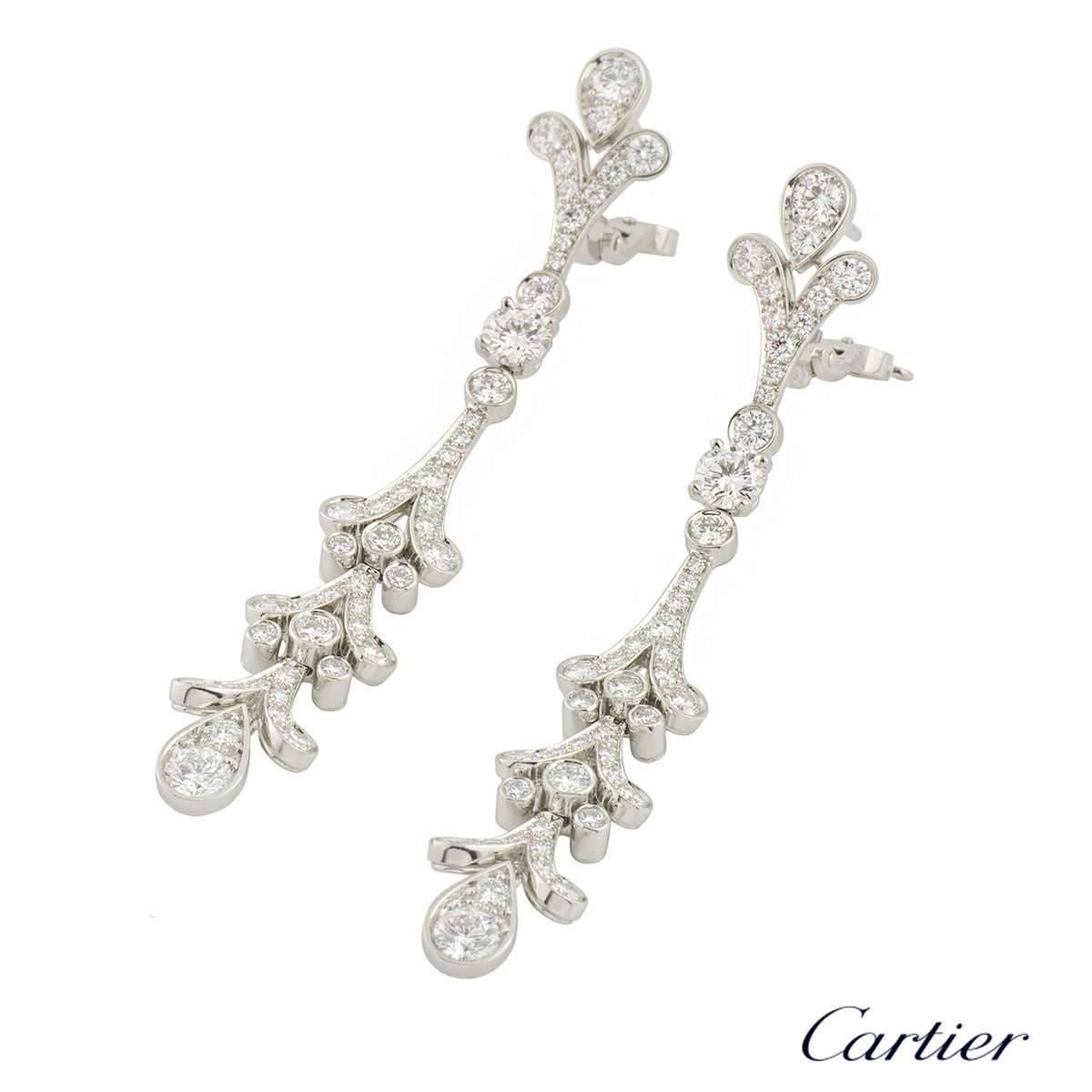 A luxurious pair of platinum diamond Cartier chandelier drop earrings from the Tulipe collection. The earrings are comprised of 72 round brilliant cut diamonds set in a rubover and pave setting. The diamonds have a total weight of approximately