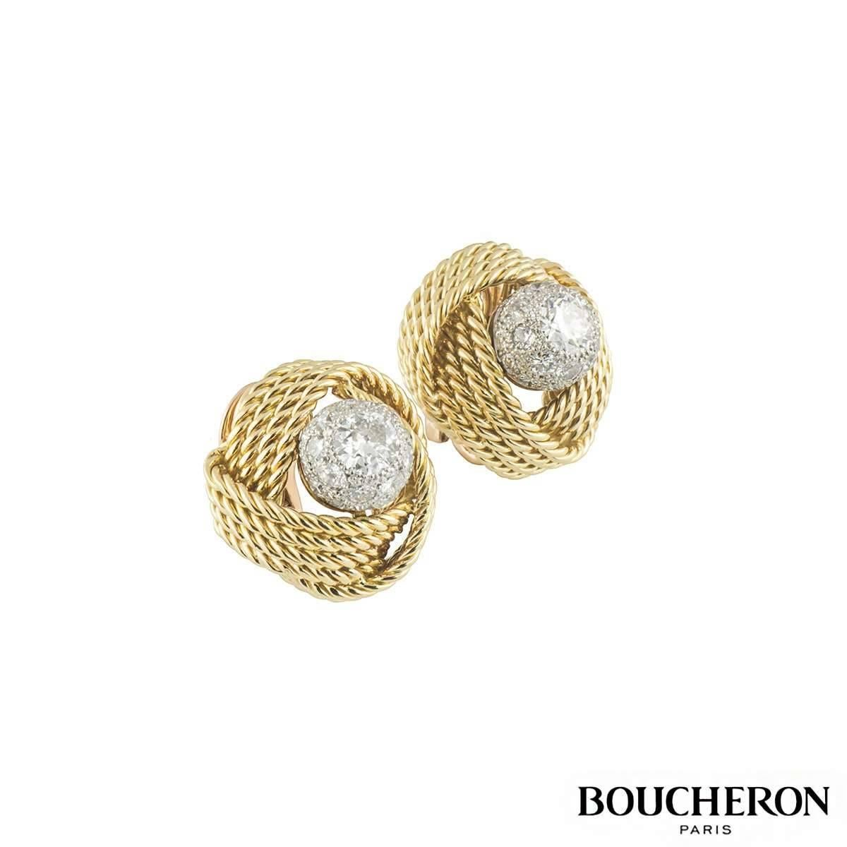 A stunning pair of vintage 18k yellow gold earrings by Boucheron C1920. The earrings are of a 4 rope knot design enclosing a diamond set stud in the centre. The stud features round brilliant cut pave set diamonds to the outer edge and a larger
