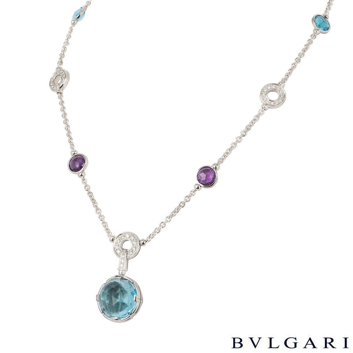 A stunning 18k white gold diamond and multi-gem necklace by Bvlgari from the Parentesi collection. The necklace comprises of the round 3 amethyst, 2 topaz spaced out on the necklace with 2 'Bvlgari Bvlgari' hoops, 3 circular hoops pave set with