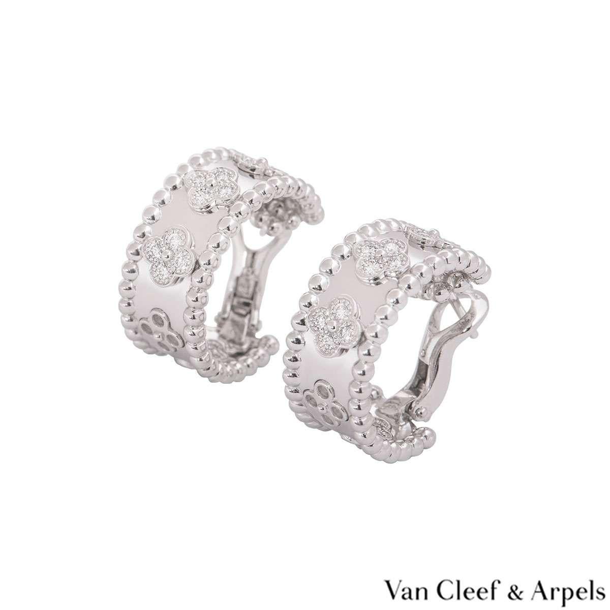 An 18k white gold pair of diamond hoop earrings by Van Cleef & Arpels from the Perlée​ Clovers collection. The earrings comprise of the iconic four leaf clover motifs spaced out evenly in the middle set with round brilliant cut diamonds and a beaded