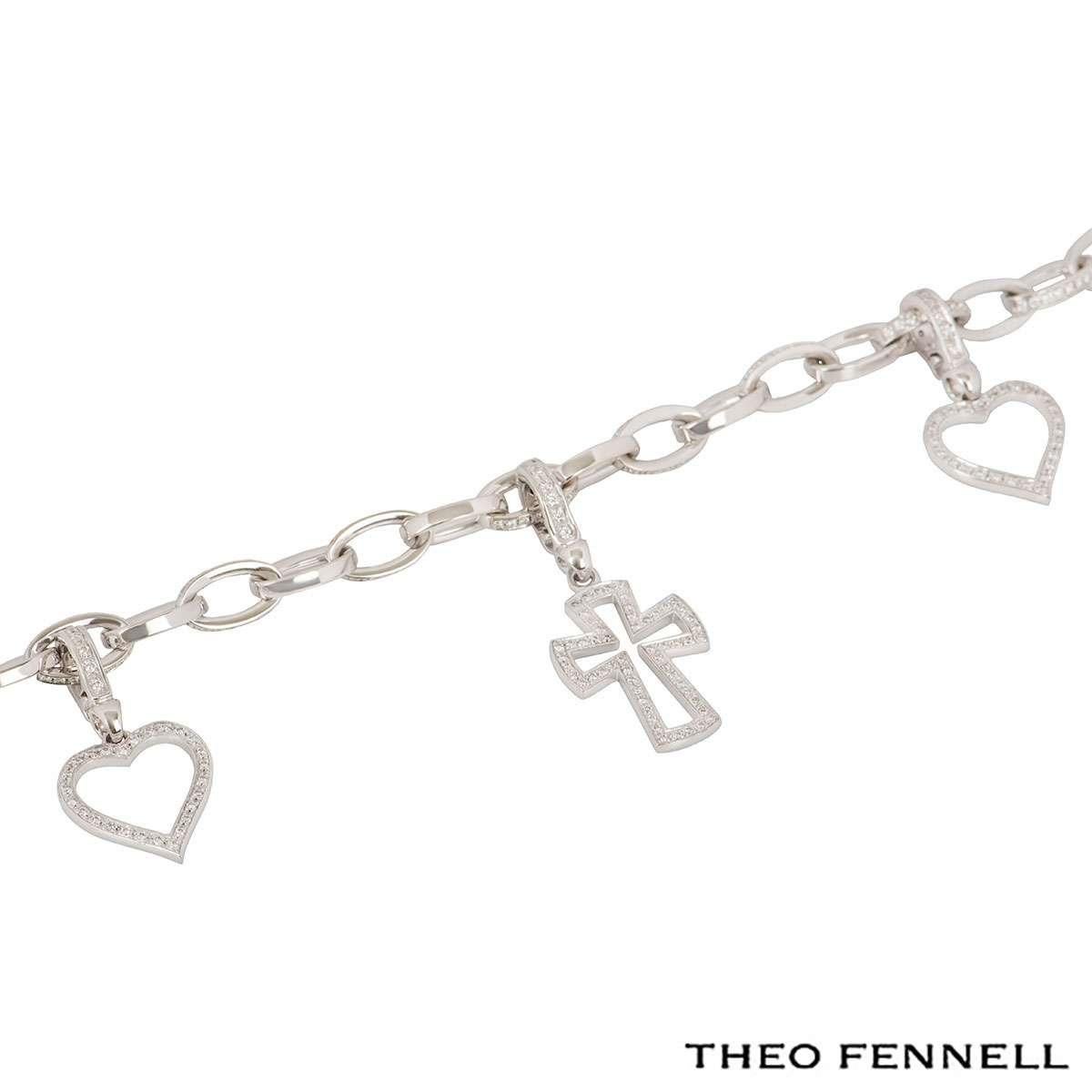 A stunning 18k white gold charm bracelet by Theo Fennell. The bracelet features 11 diamond links with 3 detachable charms including 2 hearts and 1 cross, all pave set with round brilliant cut diamonds. The diamonds have a total weight of