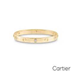 Bracciale Cartier “Love” in oro giallo con mezzi diamanti, misura 17, codice B6026317