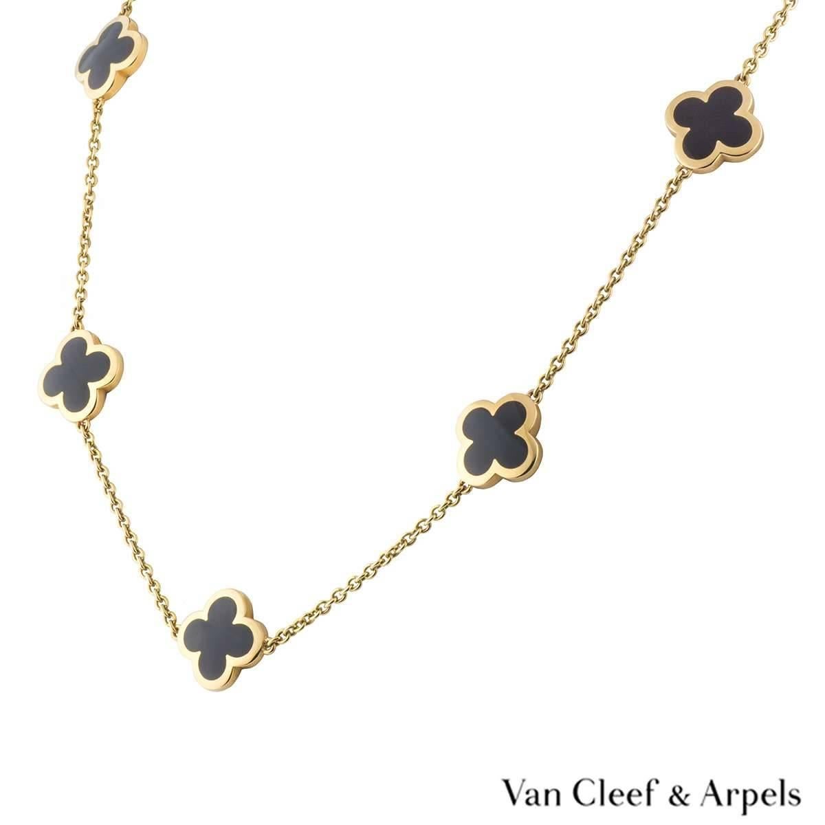 A beautiful 18k yellow gold necklace from the Van Cleef & Arpels Magic Alhambra collection. The necklace is composed of 14 iconic four leaf clover motifs, set to the centre with black onyx inlays. Each motif features a beaded outer edge and are
