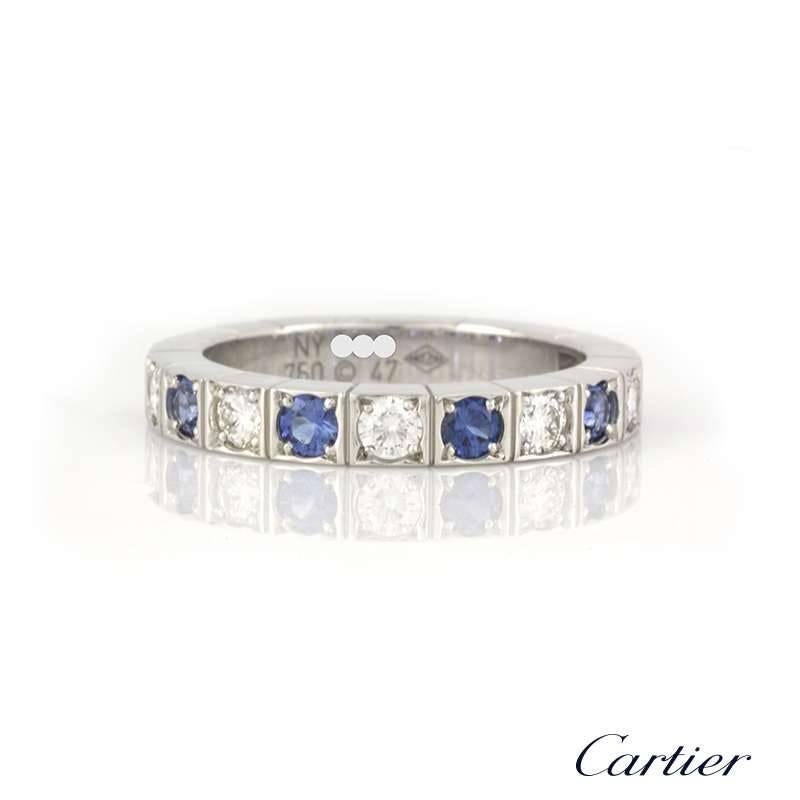 A stunning 18k white gold diamond and sapphire ring form the Cartier Lanieres collection. The ring is set to the front with 12 alternating round brilliant cut diamonds and sapphires, complemented by the iconic Lanieres design around the back and