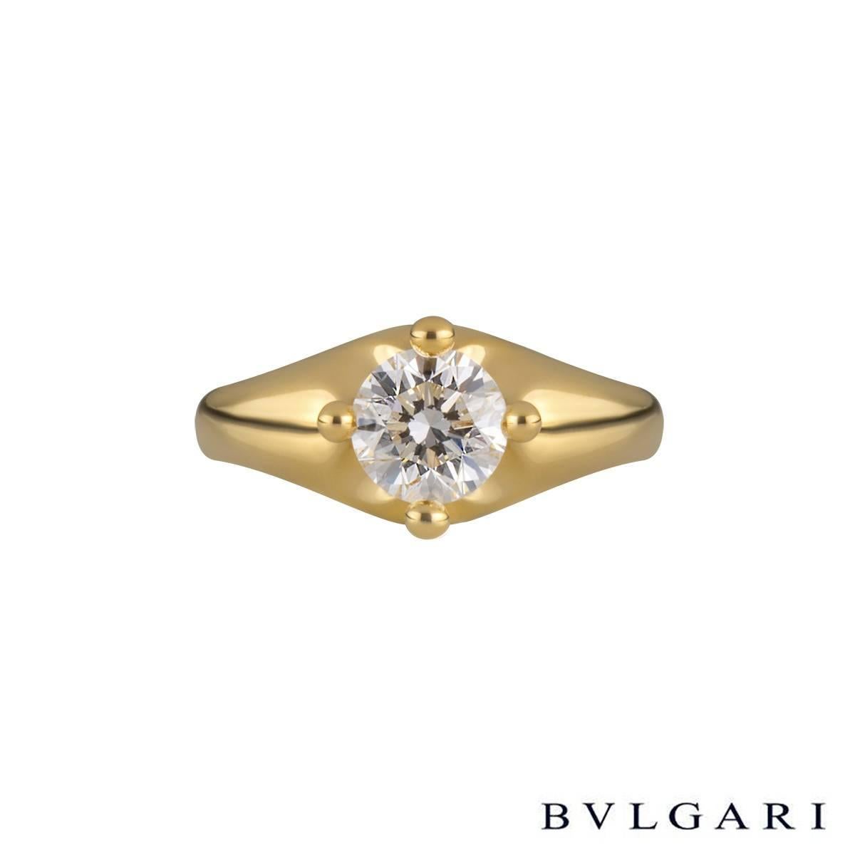 A stunning diamond single stone ring in 18k yellow gold by Bvlgari. The ring is set to the centre with a 1.01ct round brilliant cut diamond in a raised four claw compass setting, D in colour and VVS1 in clarity. The tapered 8mm ring is currently a
