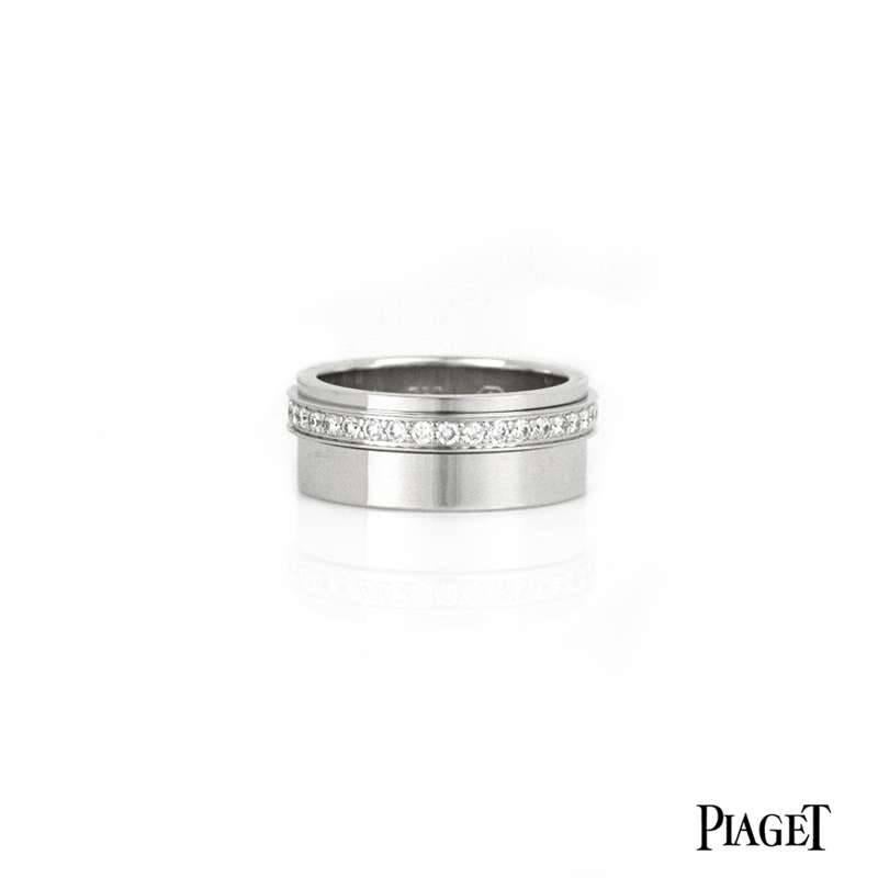 An 18k white gold Piaget Possession diamond set ring.  The 18k white gold 8mm band is set with a spinning diamond band comprised of 37 diamonds totalling 0.63ct. The ring is a US size is 7 1/4, EU size 55 and UK O1/2. The gross weight is 11.54