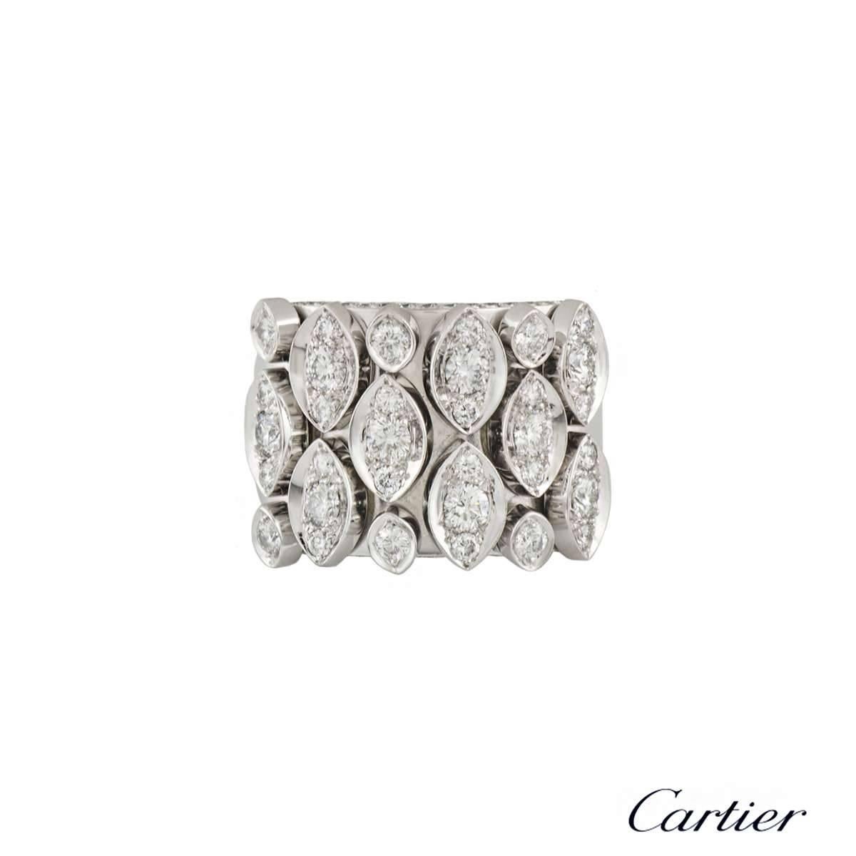A sparkly 18k white gold Cartier articulated diamond ring. The ring comprises of marquise articulated motifs in different sizes with a total of 33 round brilliant cut diamonds set inside them. The ring has 30 round brilliant cut diamonds pave set on