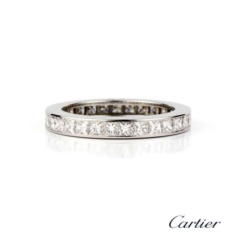 A timeless Cartier 18k white gold full eternity ring.  The channel set Princess cut diamonds total 1.76ct. Colour G, Clarity VS. Finger Size Euro 52, UK M and US size 6.

With our own presentation box and Certificate of Authenticity.
