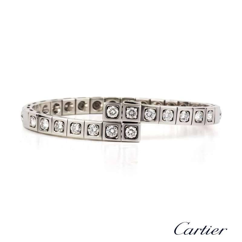 An 18k white gold diamond set Tectonique bracelet by Cartier. The bracelet is comprised of square links, of which 21 are set with a single 0.15ct round brilliant cut diamond set within a grain setting totalling 3.15ct, colour D/E and VVS clarity.