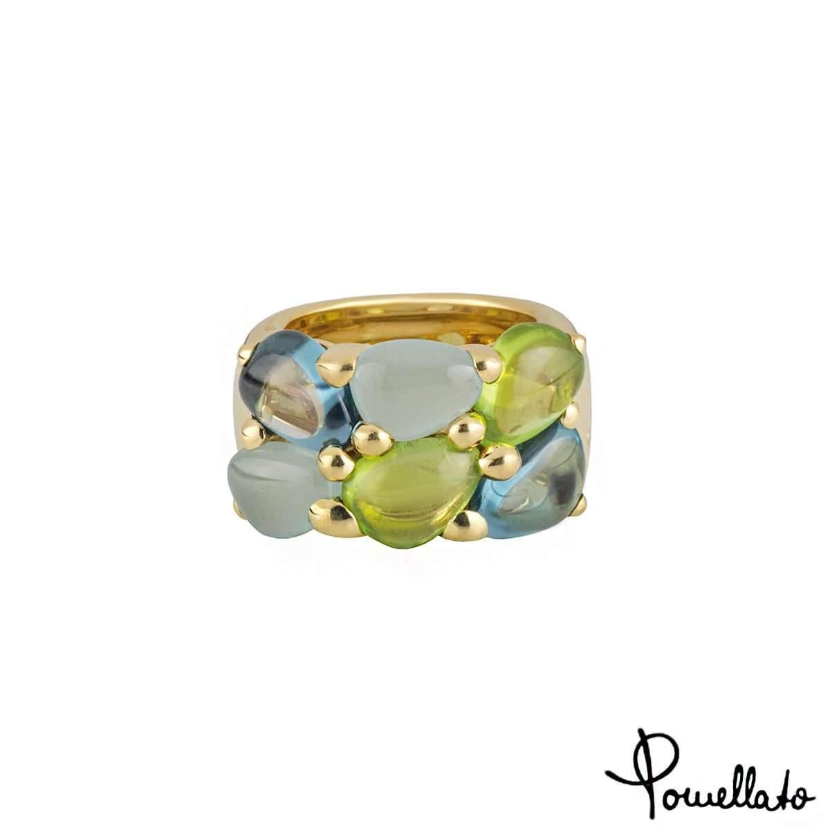 A unique 18k yellow gold Pomellato multi-gemstone ring from the Saffi collection. The ring features 2 peridot, 2 aquamarine and 2 topaz gemstones. The ring is a size O, US size 7 and measures 13mm in width. The ring has a gross weight of 24.2