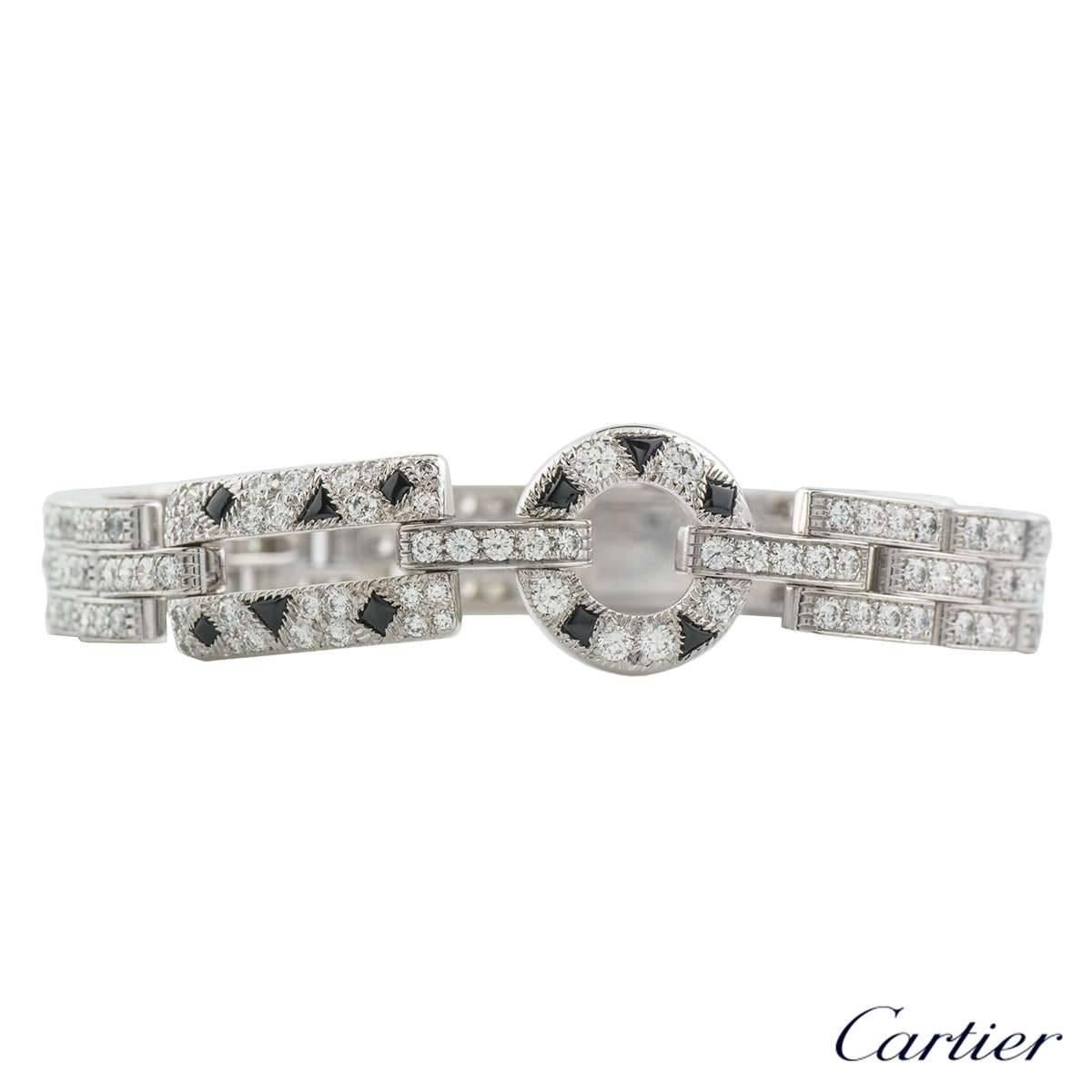 A beautiful Cartier 18k white gold diamond and onyx bracelet from the Panthere de Cartier collection. The bracelet comprises of 3 rows of linked bars with round brilliant cut diamonds, meeting in the middle is an open work loop and a rectangle with