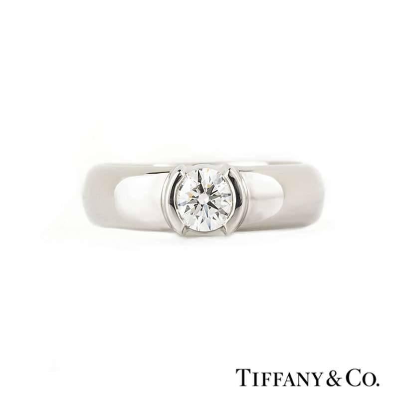 A single stone diamond ring in platinum from the Tiffany & Co Etoile collection. The round brilliant cut diamond weighs 0.50ct, is G in colour and VS1 clarity. The ring is currently a size K1/2, US 5 3/8 but can be adjusted for a perfect fit and has