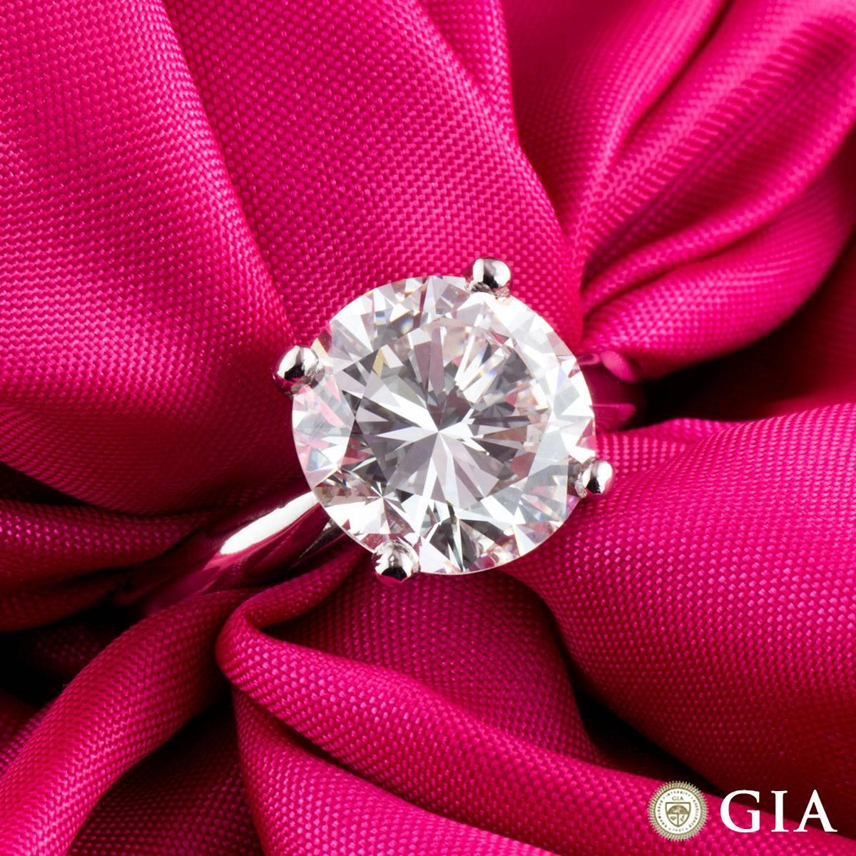 An exquisite diamond single stone ring in platinum. The 3.93ct round brilliant cut diamond is set in a timeless four claw setting, the colour is H and the clarity is VS1. The 3mm tapered ring is currently a US size 6, UK size M but can be adjusted