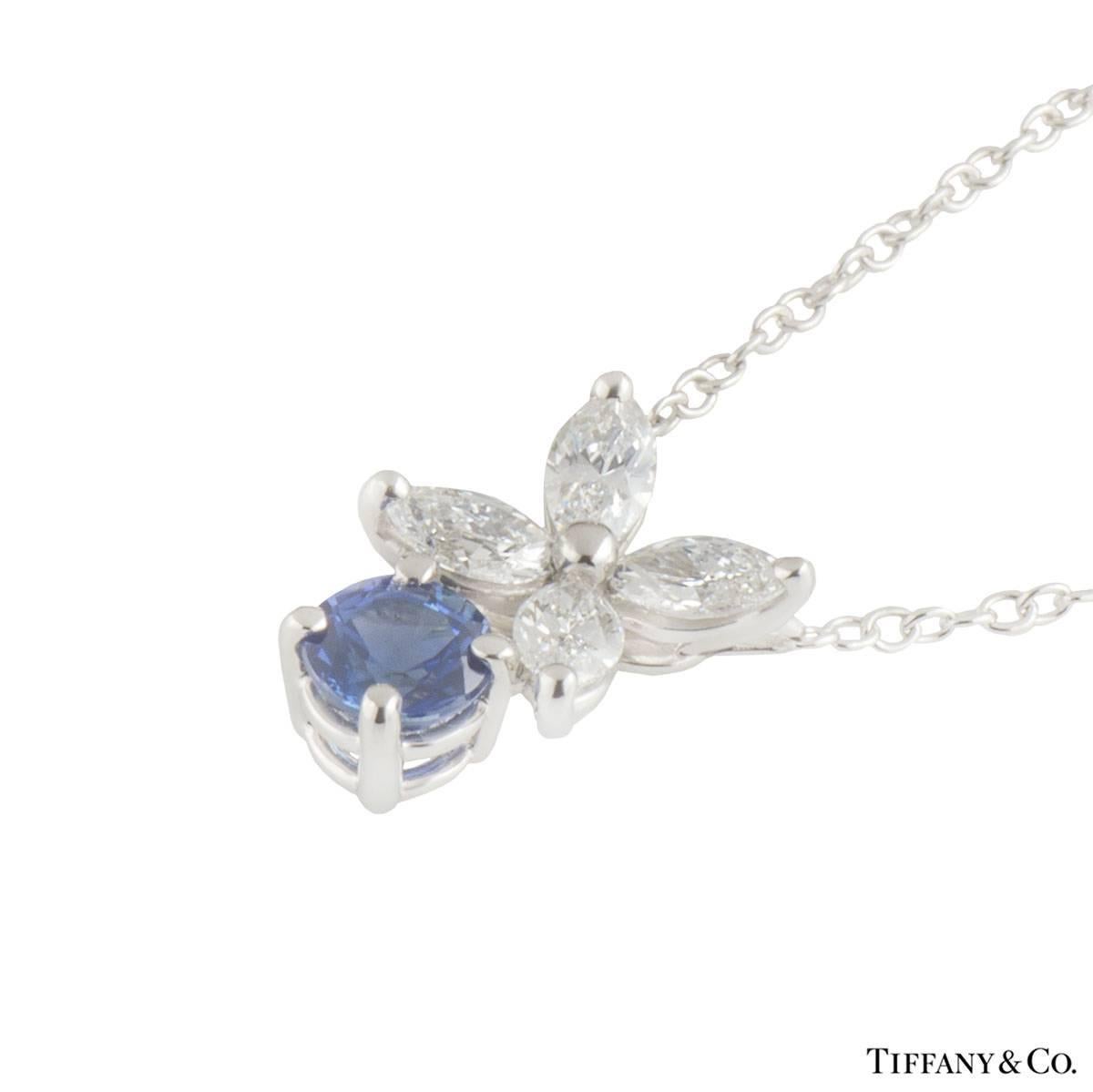 A platinum diamond and sapphire Tiffany & Co. necklace from the Victoria collection. The necklace comprises of 4 marquise cut diamonds in a clawed setting with a round brilliant cut sapphire placed at the bottom in a 4 claw setting. The diamonds