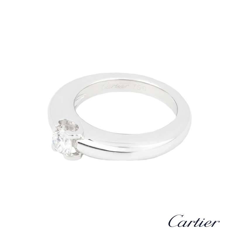 A beautiful 18k white gold diamond single stone ring from the C De Cartier collection by Cartier. The ring is set to the centre with a round brilliant cut diamond weighing approximately 0.33ct, E/F colour and VVS in clarity set in the iconic C de