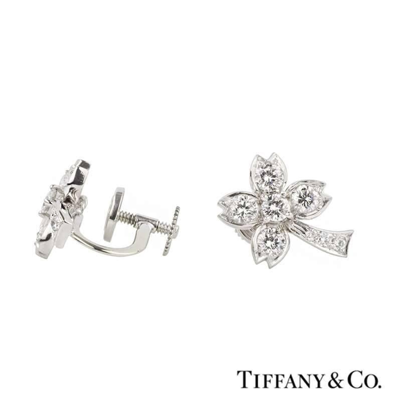 A stunning pair of diamond set palm tree earrings in platinum by Tiffany & Co. The earrings are in a palm tree design motif and are each set with five round brilliant cut diamonds through the leaves and branches and pave set with 3 graduating round