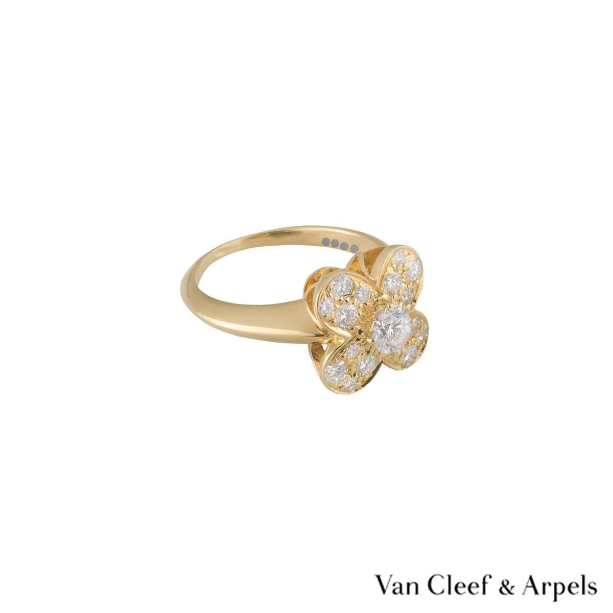 A beautiful 18k yellow gold Van Cleef & Arpels diamond ring from the Alhambra collection. The central flower motif is set with a single claw set round brilliant cut diamond weighing approximately 0.30ct, G colour and VS clarity. The petals of the