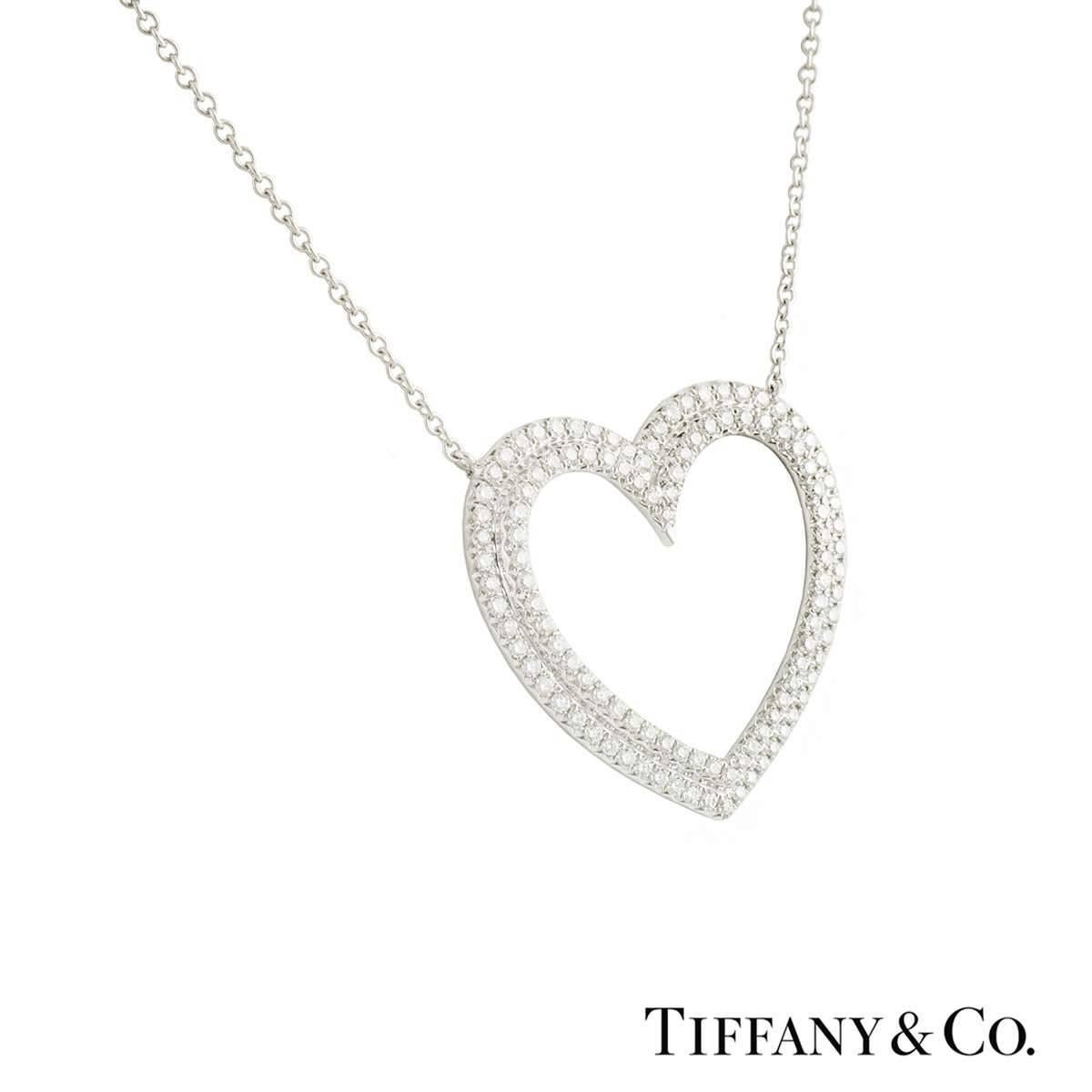 A beautiful platinum Tiffany & Co. diamond heart pendant from the Metro collection. The pendant comprises of a double heart motif with 114 round brilliant cut diamonds with a total weight of approximately 0.76ct, F colour and VVS clarity. The