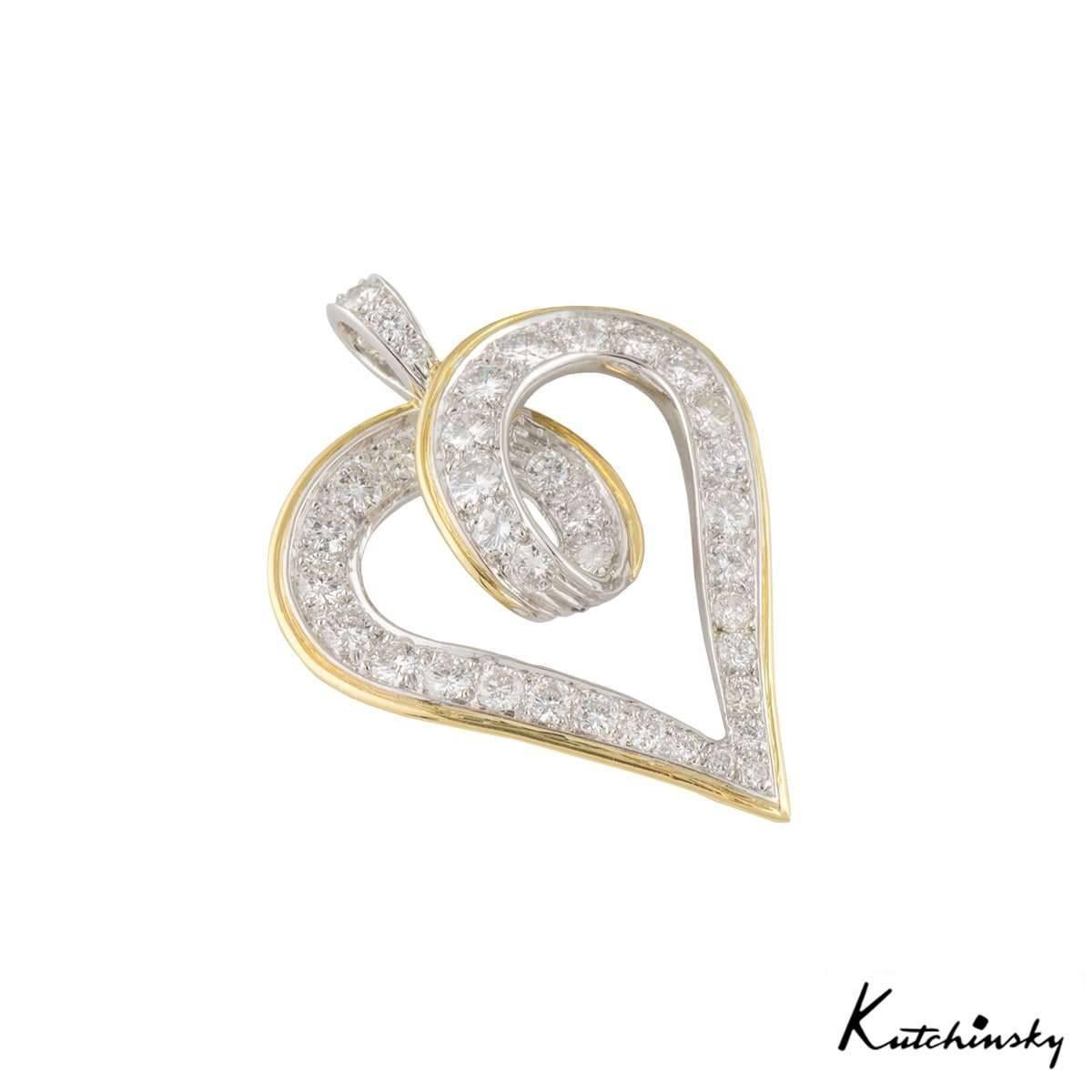 An 18k white & yellow gold heart shape pendant by Kutchinsky. The openwork heart motif displays a boarder of yellow gold and is set with 37 round brilliant cut diamonds totalling approximately 1.47ct, predominantly F colour and VVS-VS in clarity.
