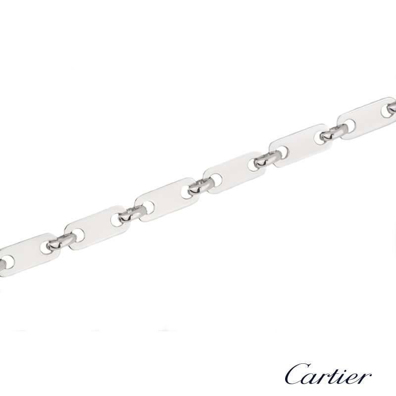 An elegant 18k white gold rectangular link bracelet by Cartier. The bracelet comprises 13 rectangular plain pierced links and alternating between each link are a round circular link. The bracelet measures 6.5 inches in length and features a open