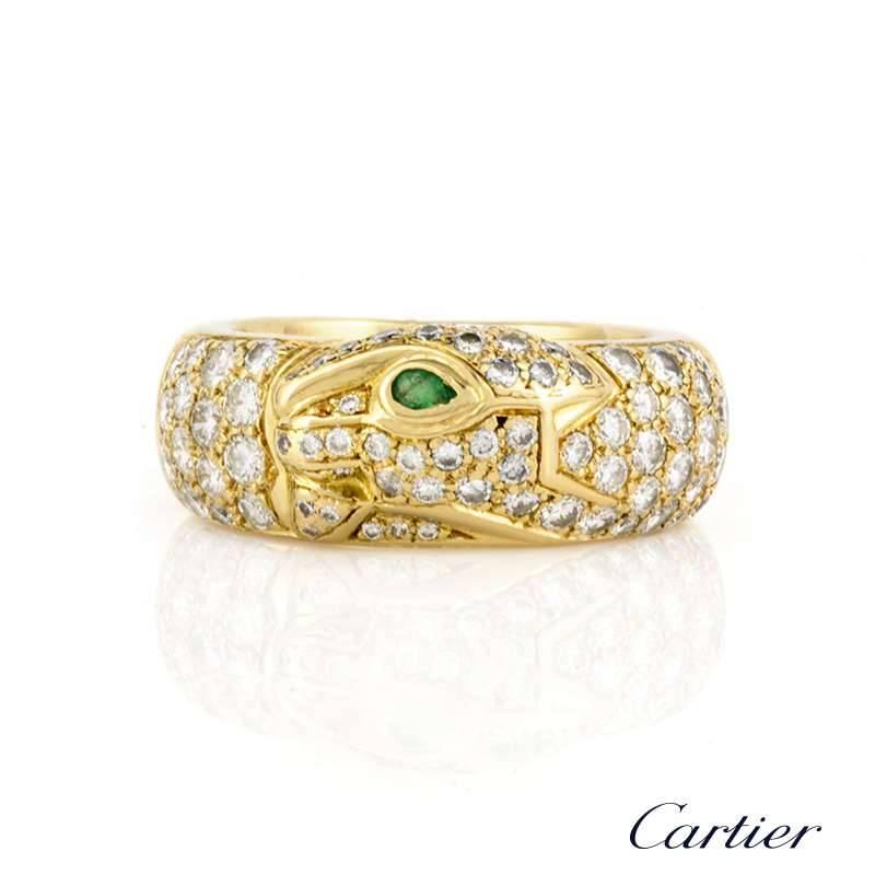An 18k yellow gold diamond set ring from the Cartier Panthere collection. The ring is composed of the iconic Panthere head, of which is pave set with graduating round brilliant cut diamonds, leading on to the main body totalling approximately