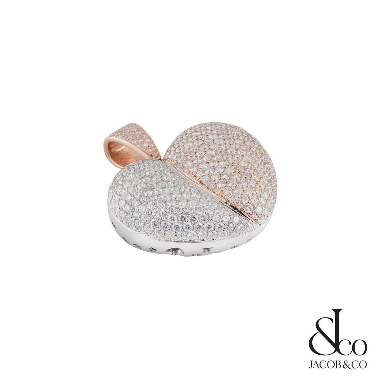 A sparkly 14k rose and white gold Jacob & Co diamond heart pendant. The pendant comprises of approximately 350 round brilliant cut diamonds in the heart in a pave setting. The diamonds come to an approximate total of 5.25ct, G colour and VS clarity.