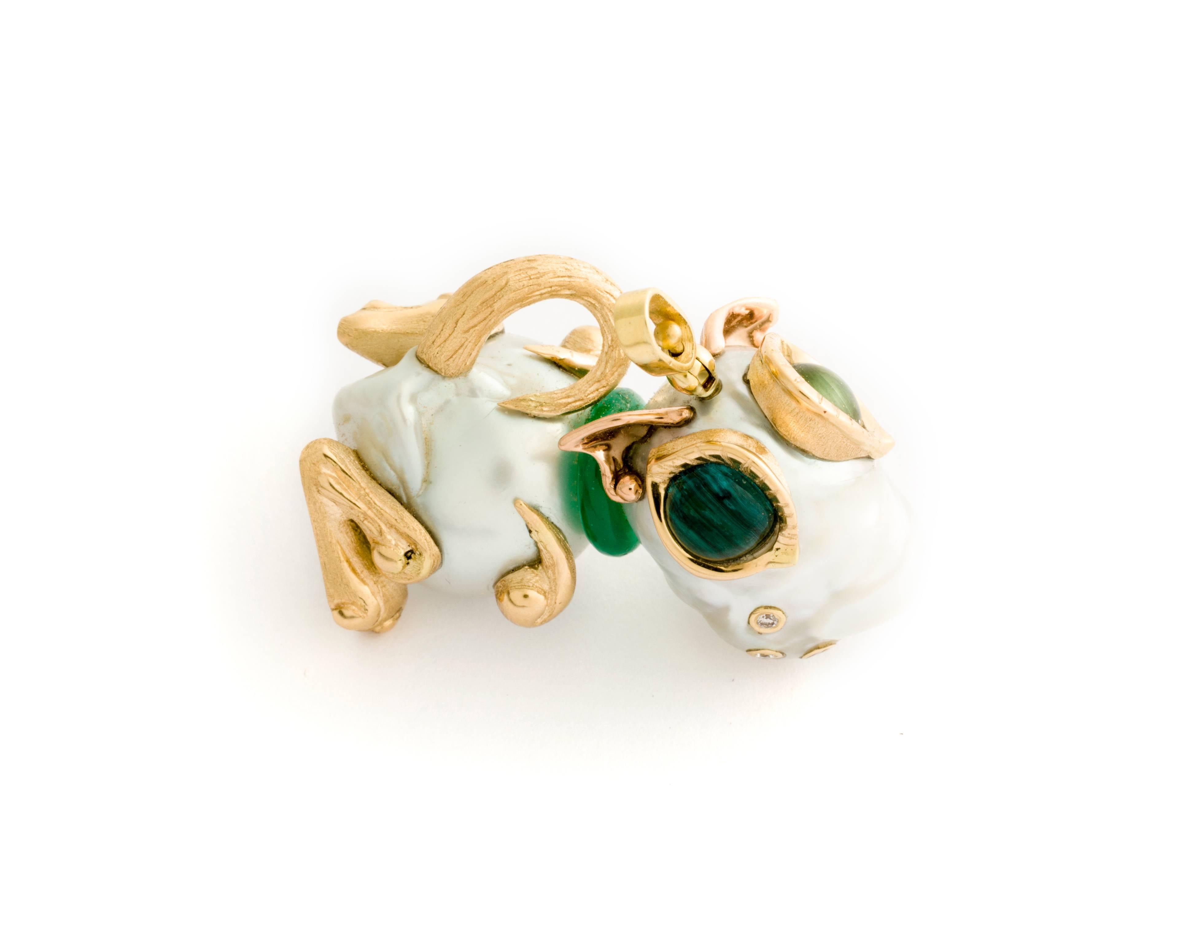 This darling little puppy pendant has two Baroque South Sea Pearls (the first 19.46 x 16.62mm and the second 17.91 x 15.60m) set in 18k yellow and pink gold with rutilated green and blue tourmaline, green jade collar ring, and .18 carats of white