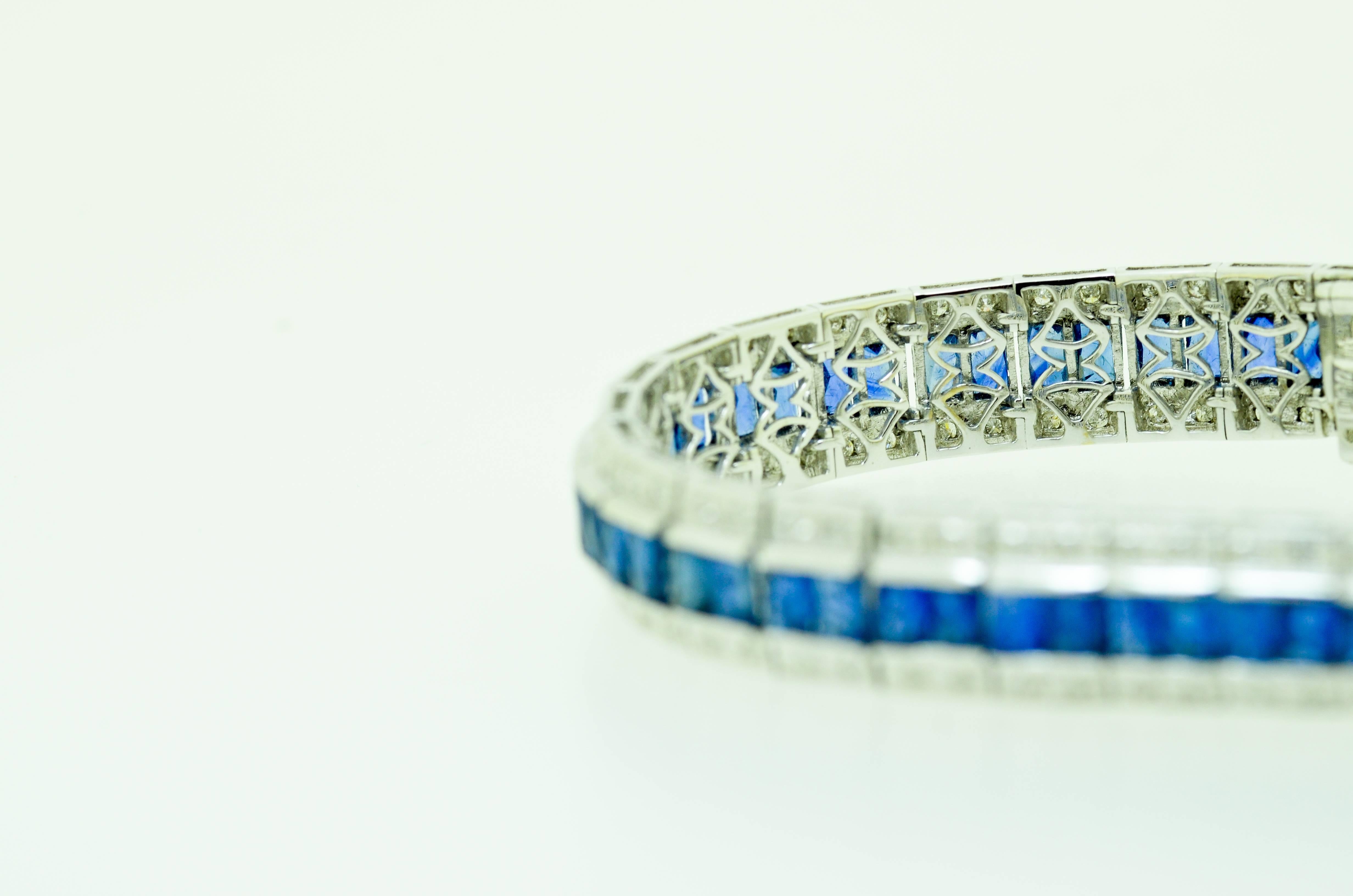 Stunning sapphire and diamond bracelet set with over 10 carats of baguette cut blue sapphires and 0.830 carat of clean white brilliant cut diamonds set in 18 karat white gold.

