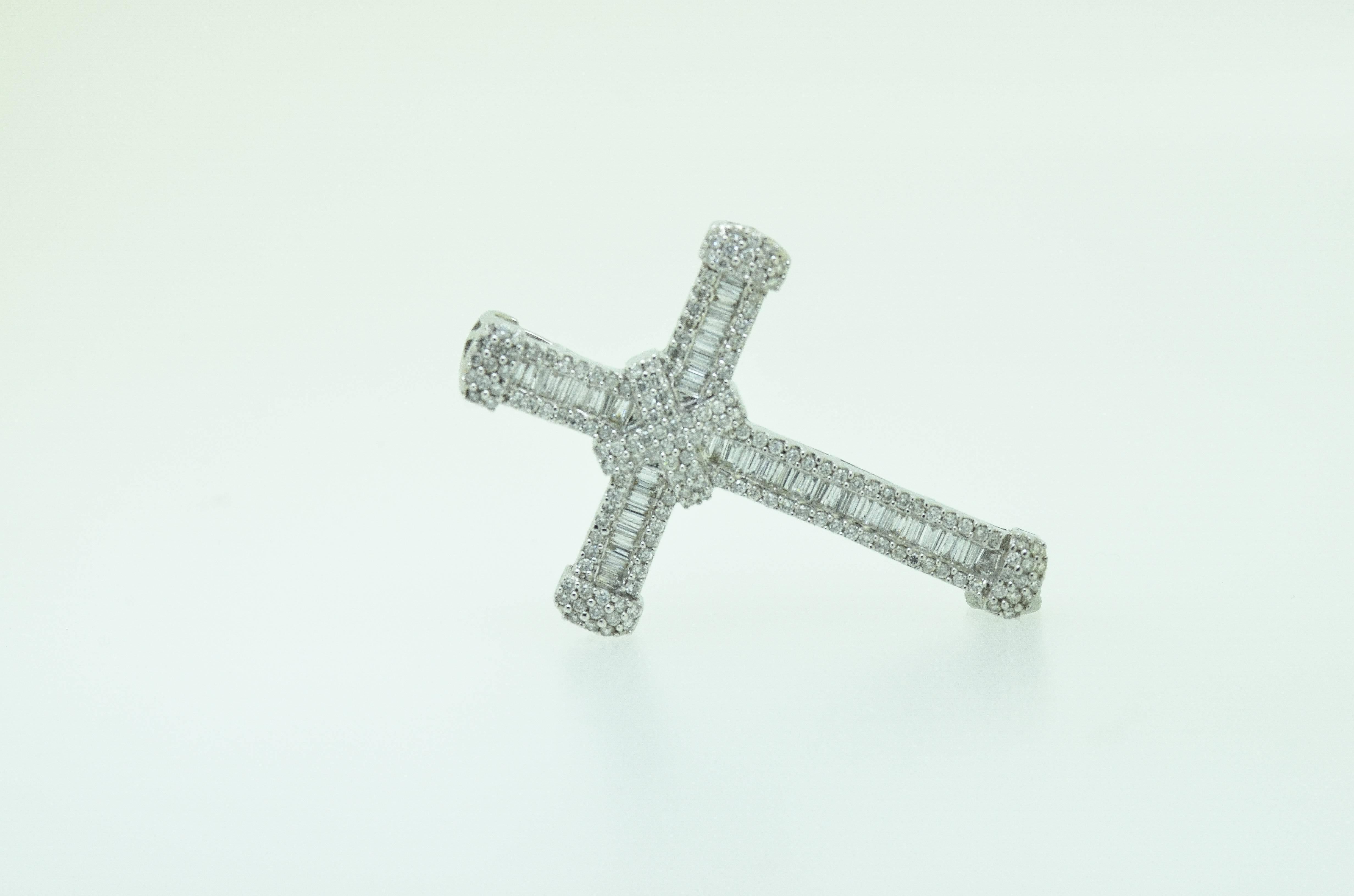 Stunning Tiffany style diamond cross set with over 4 carats of baguette and brilliant cut diamonds mounted in 18 karat white gold