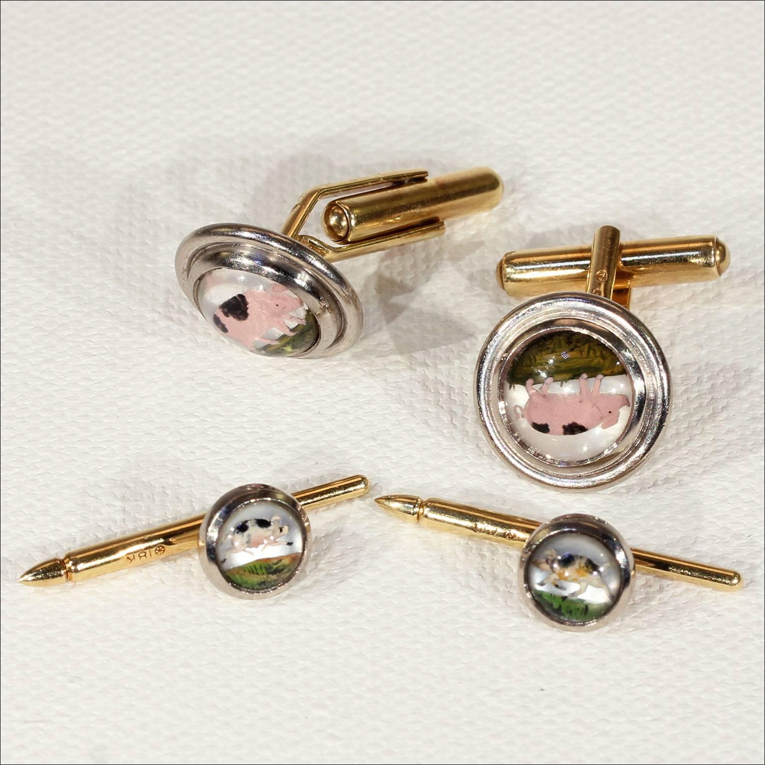 This stunning English Theo Fennell cuff link and stud set was made in 1994. These links and studs are done using a old technique called Essex crystals, wherein a cabochon cut crystal has been reversed carved and painted to give the look of a