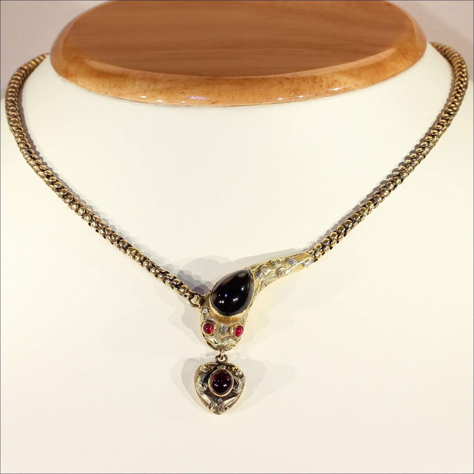 I was thrilled when I came across this fabulous Victorian garnet snake necklace that was handcrafted around 1870 in England. The wonderfully detailed clasp is done in yellow gold with pink, white and green gold leaves and swirling overlays. It