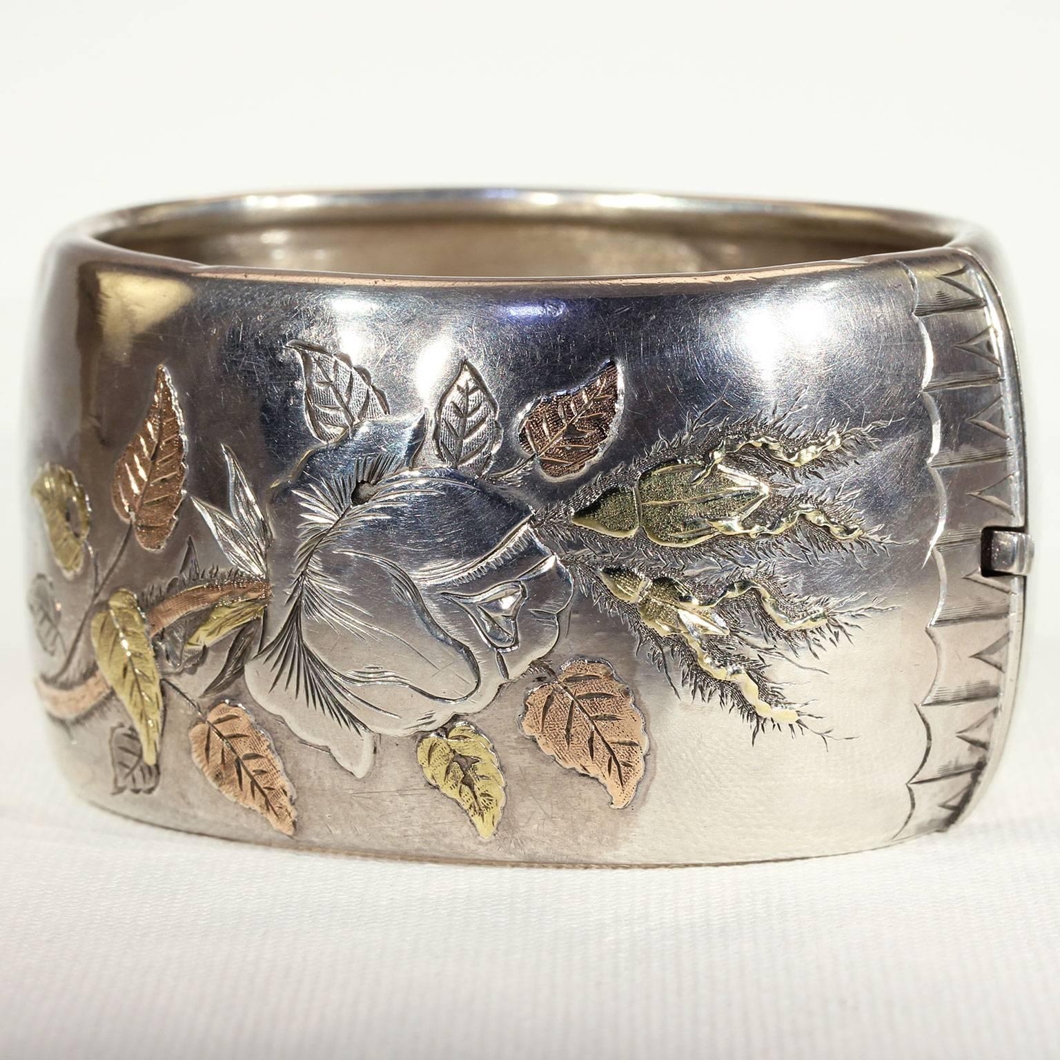 Bangles are for dancing, preferably outside beneath the rays of the sun, so the light can bounce off the silver. This graceful Victorian silver bangle was handcrafted in England around 1880. It features a beautiful engraved motif of a silver flower
