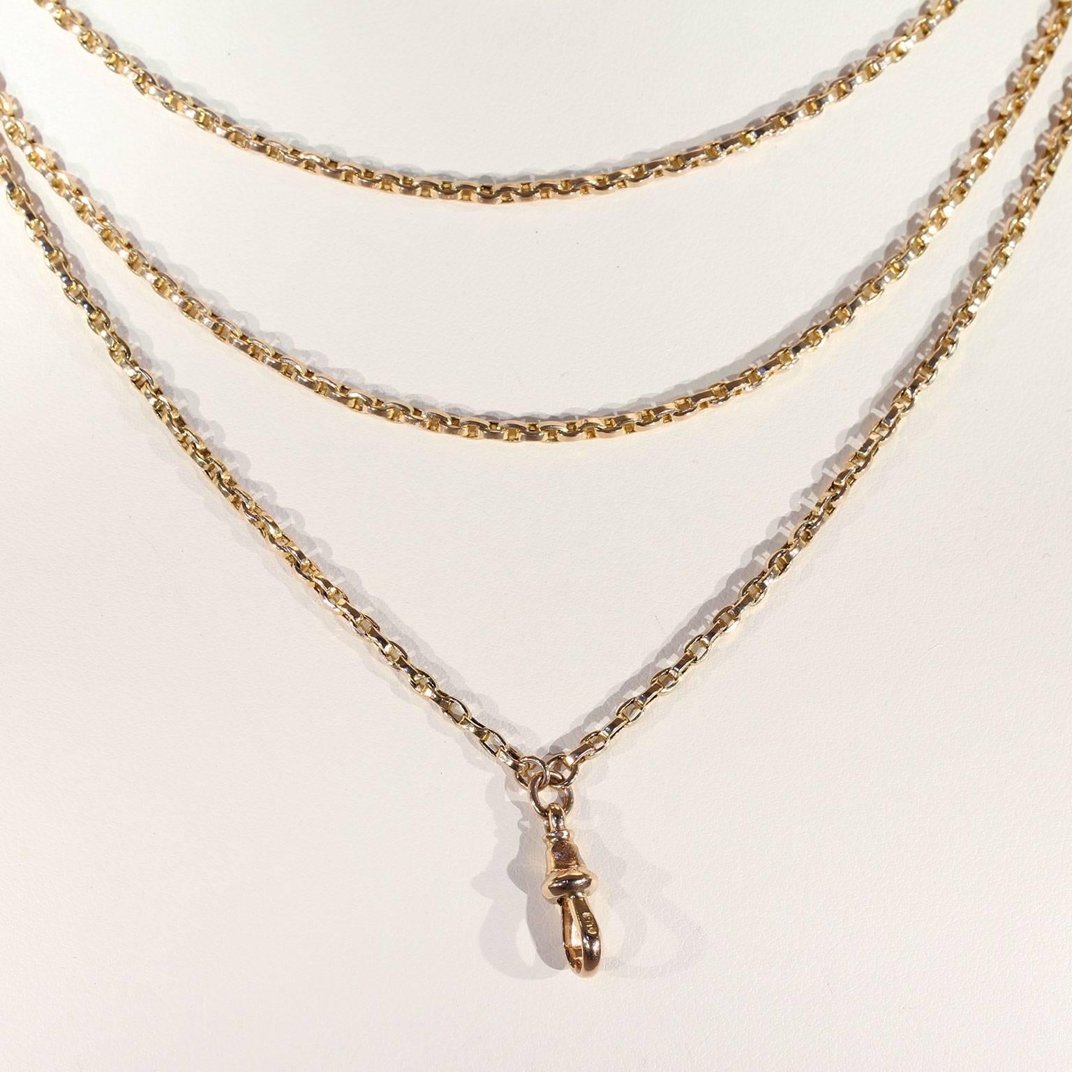This fabulous antique Victorian gold chain was handcrafted around 1890, in England. This long and shiny chain holds links that measure 3.2 mm in length. It is hallmarked with the gold purity content mark, ‘15’, meaning it was made in 15 karat