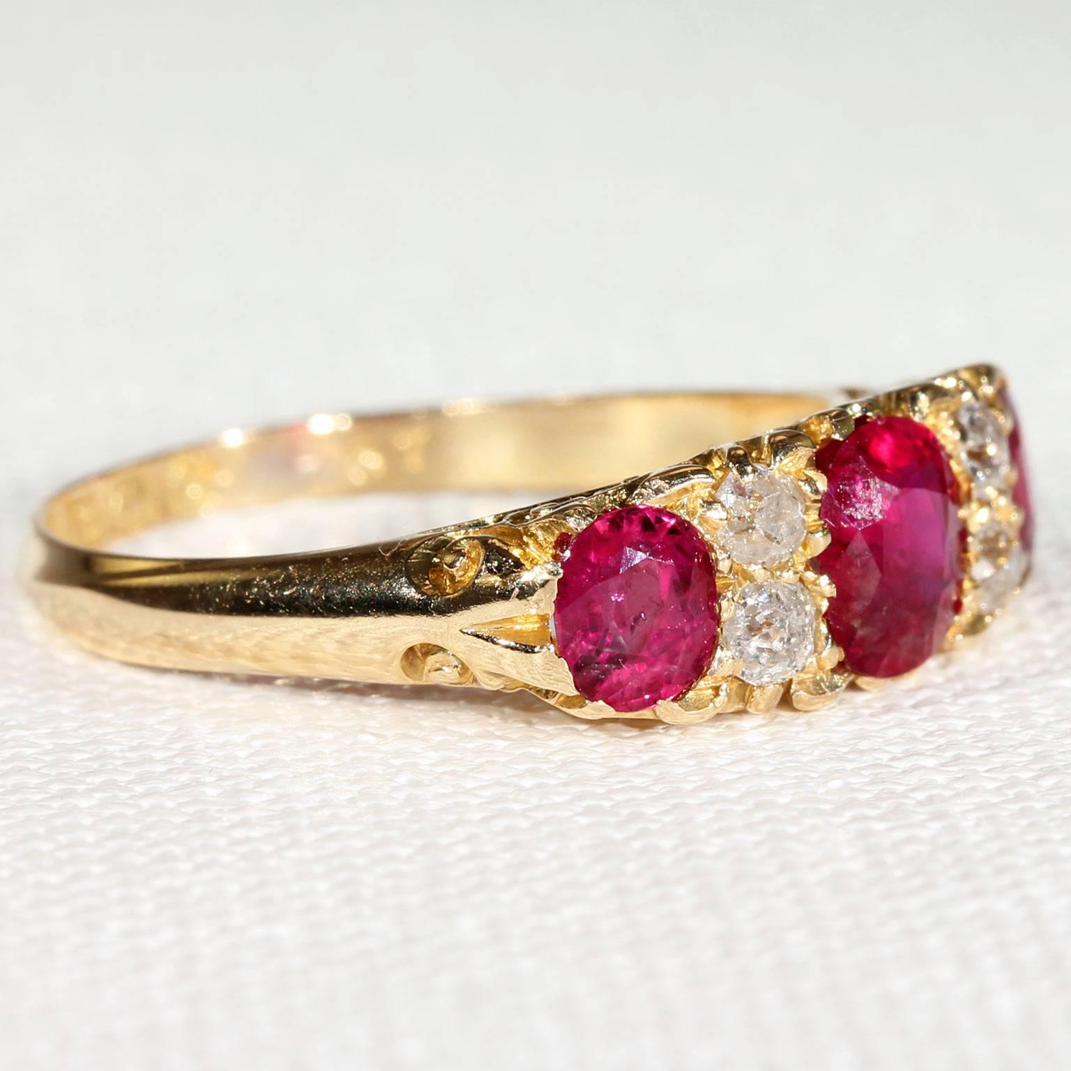 Three pidgeon blood red rubies are the stars of this goreous Edwardian ring. This English rose is set with three untreated Burmese rubies, the center stone measures 5.8 x 5.2 x 3.5 mm and weighs approximately .8 carats, the other two rubies measure