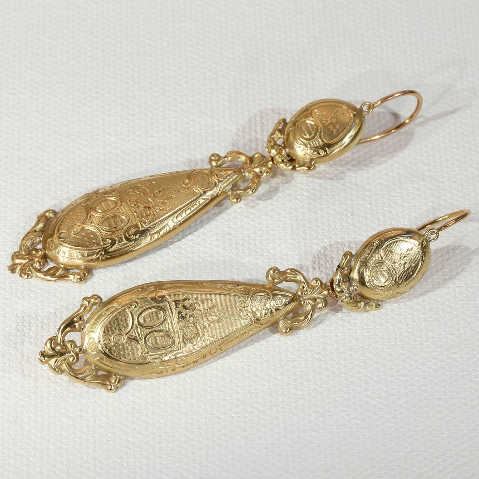 These French beauties go from day to night with ease by simply adding their removable drop pendants. Hand crafted with extremely fine detail in France in about 1830 in 18 karat gold. The earrings are marked on all four parts with the French assay