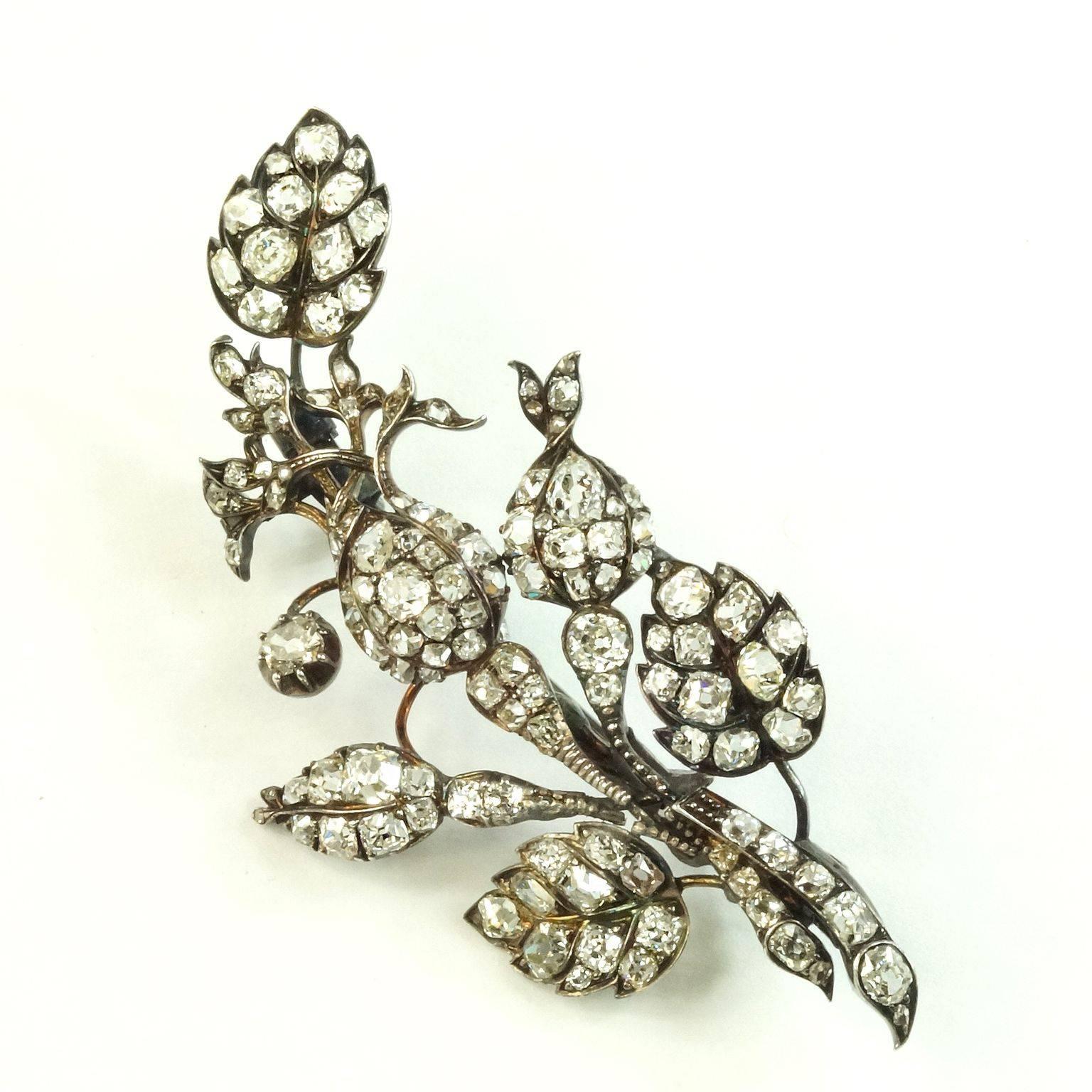 Victorian diamond flower spray brooch silver front with yellow gold
back. So beautiful!
Approximately 11.00 ct. Rose cut diamonds
Measures 2 3/4" (7 cm) in length and 2" (5.1 cm) in width at widest point.
Bring back the brooch!
