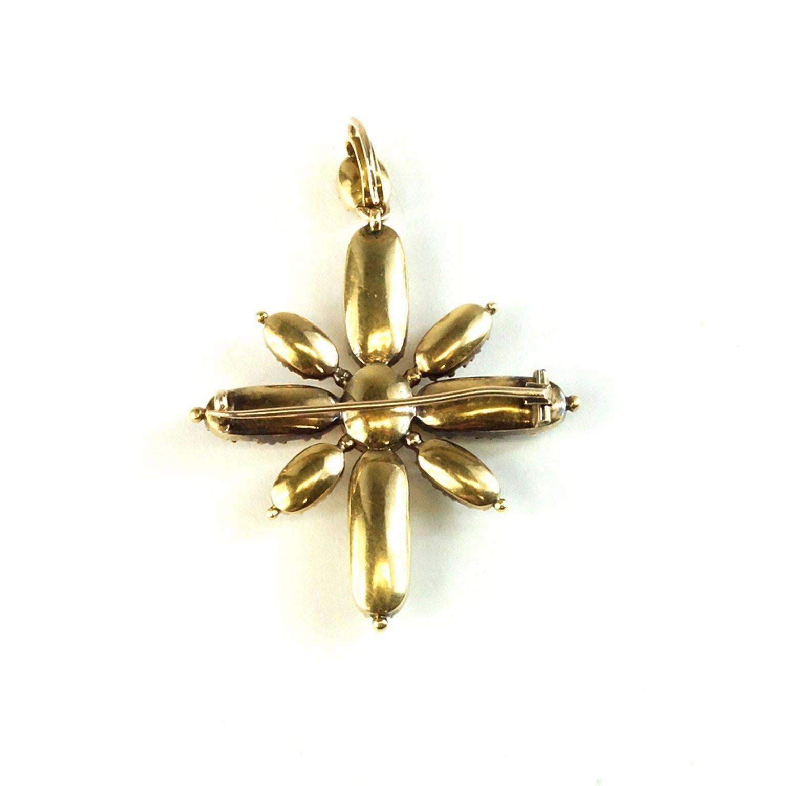 Beautiful imperial topaz flower cross!!!! Circa 1890 French 15kt yellow gold, solid backed, elongated cut stones. The cross measures 2 inches in length and 1.5 inches wide.  The cross comes in its original box.



