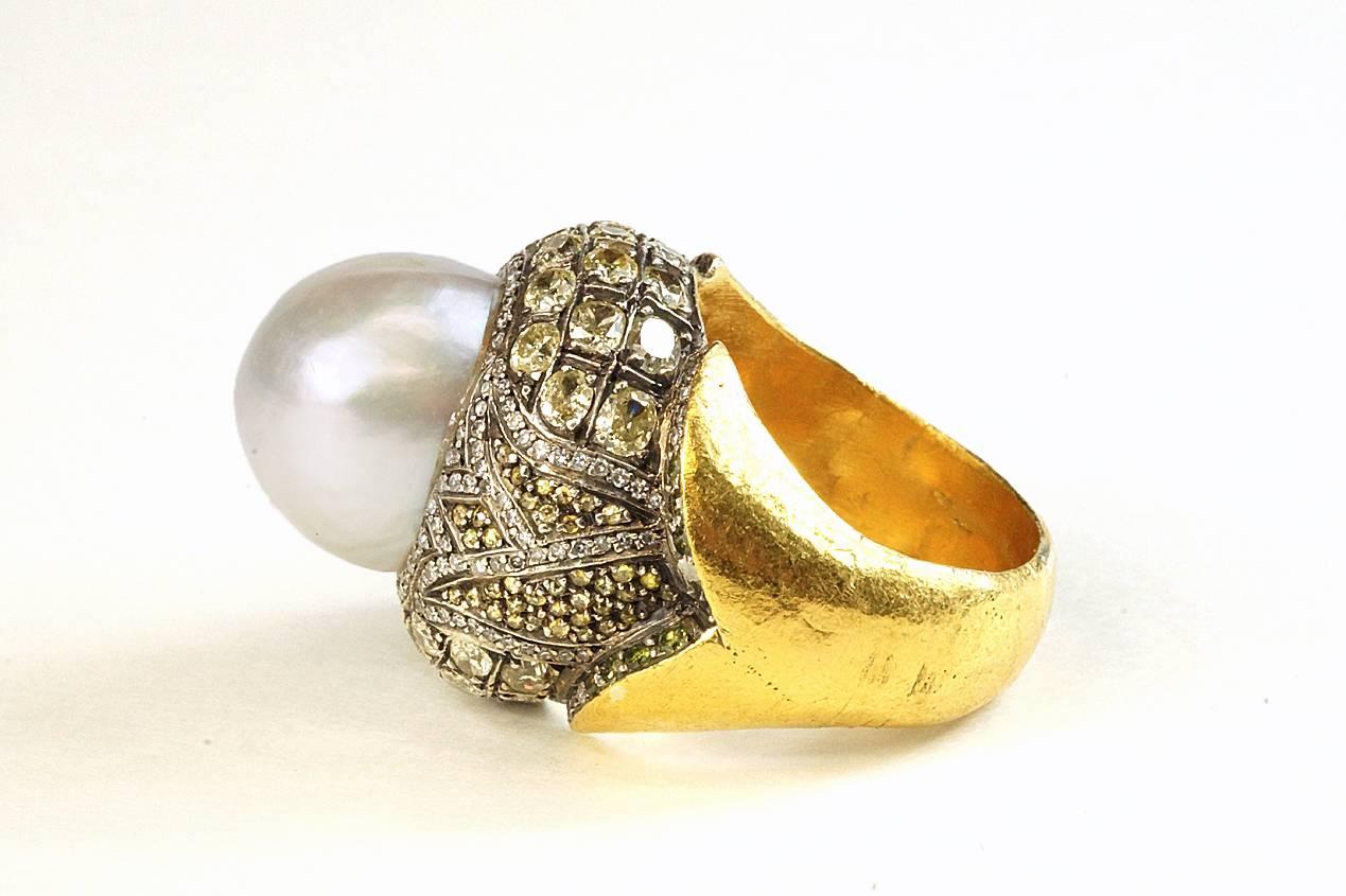 The beautiful and intricate work of Sevan Bicaki is typified in this gorgeous South Sea pearl ring.  Certainly a statement piece, this dome shaped ring is set with a 13.5mm South Sea pearl. Diamonds are set in the pattern of a tulip, which is the