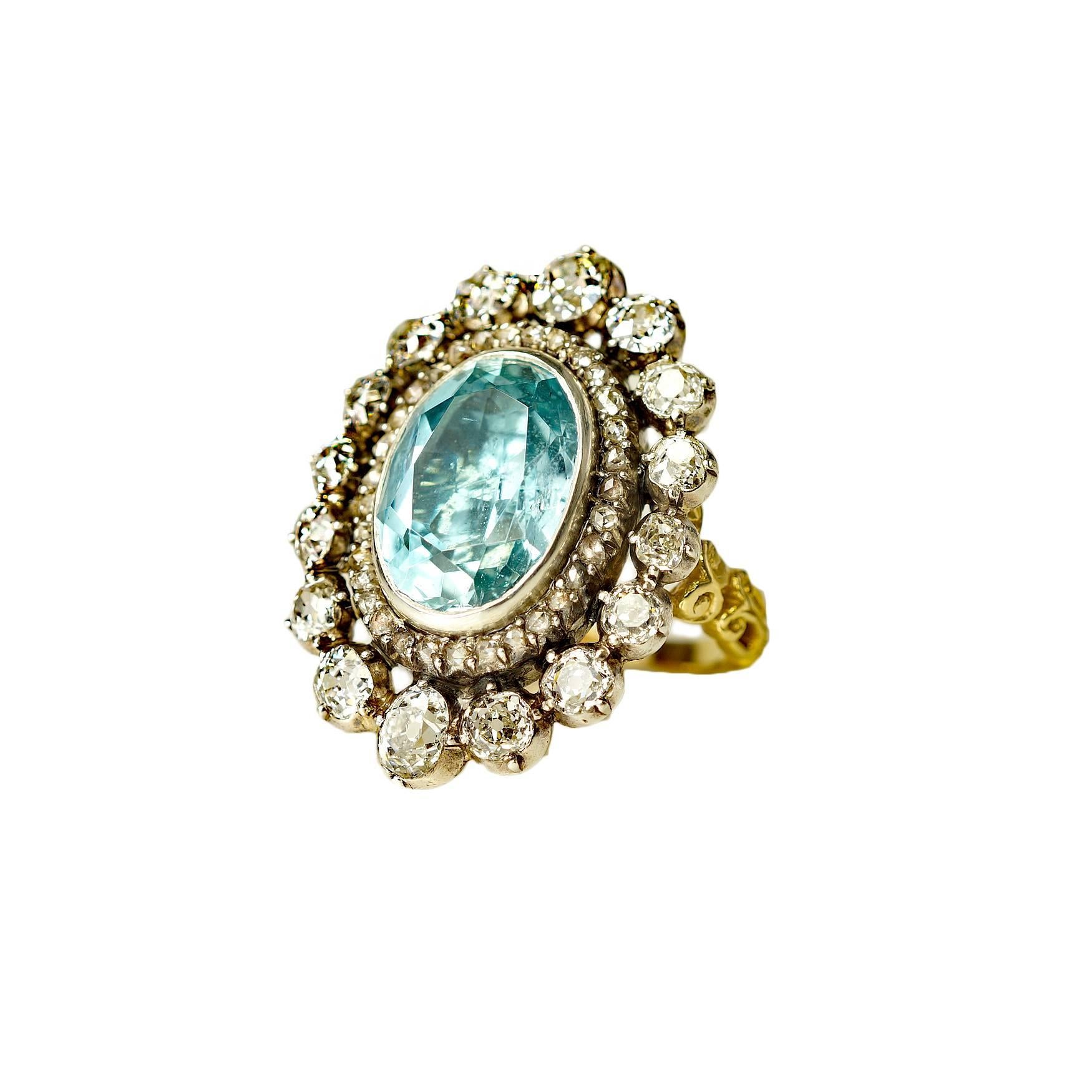 This ring is sooooo pretty.  Fits so nicely on the hand .  Oval aquamarine in a silver over gold setting surrounded by 16 beautiful Old European cut diamonds and 33 Old Mine cut diamonds 