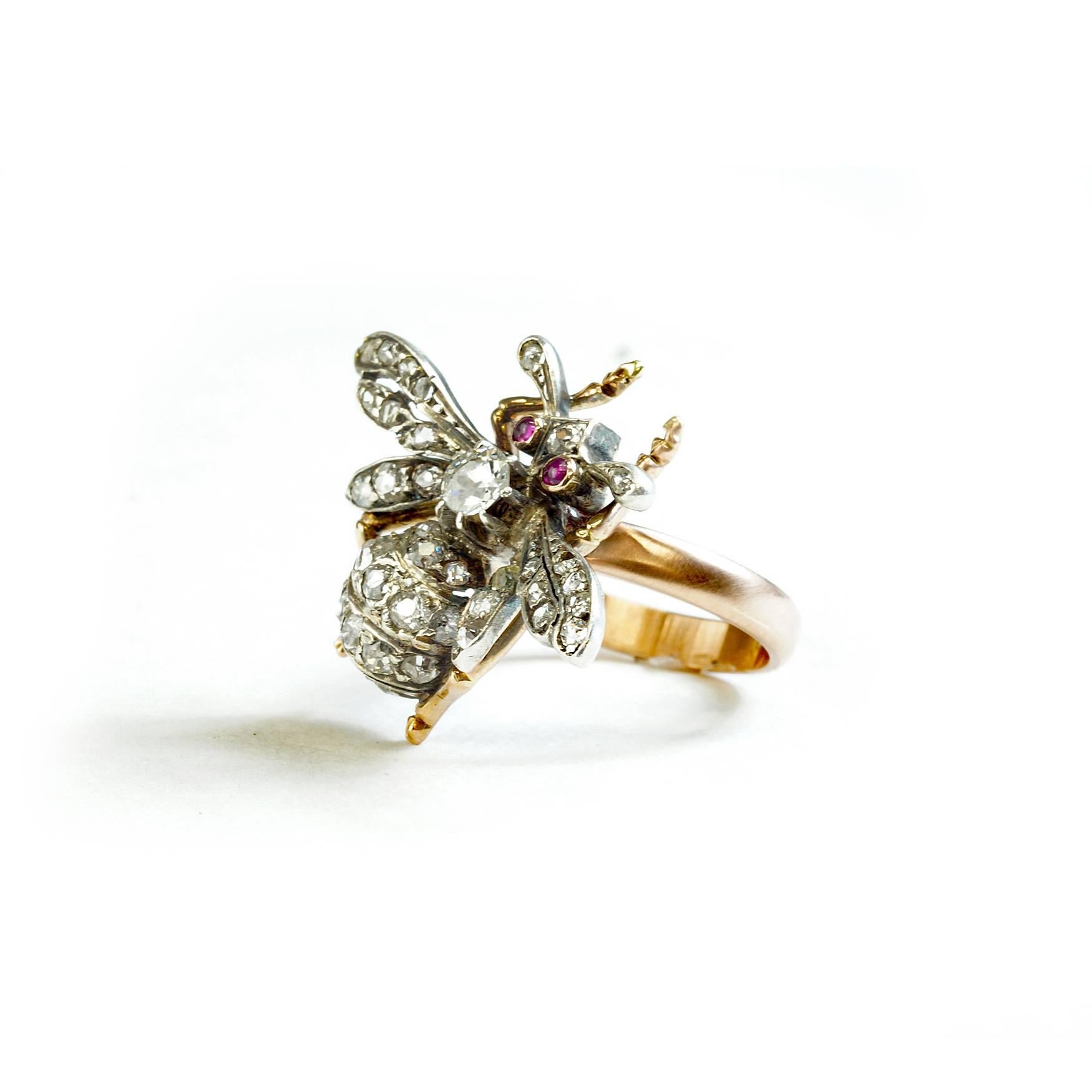 This is a beautiful silver over gold Victorian Bee that I converted to a ring.  Bugs are the rage this season.  They are on all the clothing, handbags, shoes and so forth, so why not on the hand. The bee is encrusted in old mine cut diamonds with